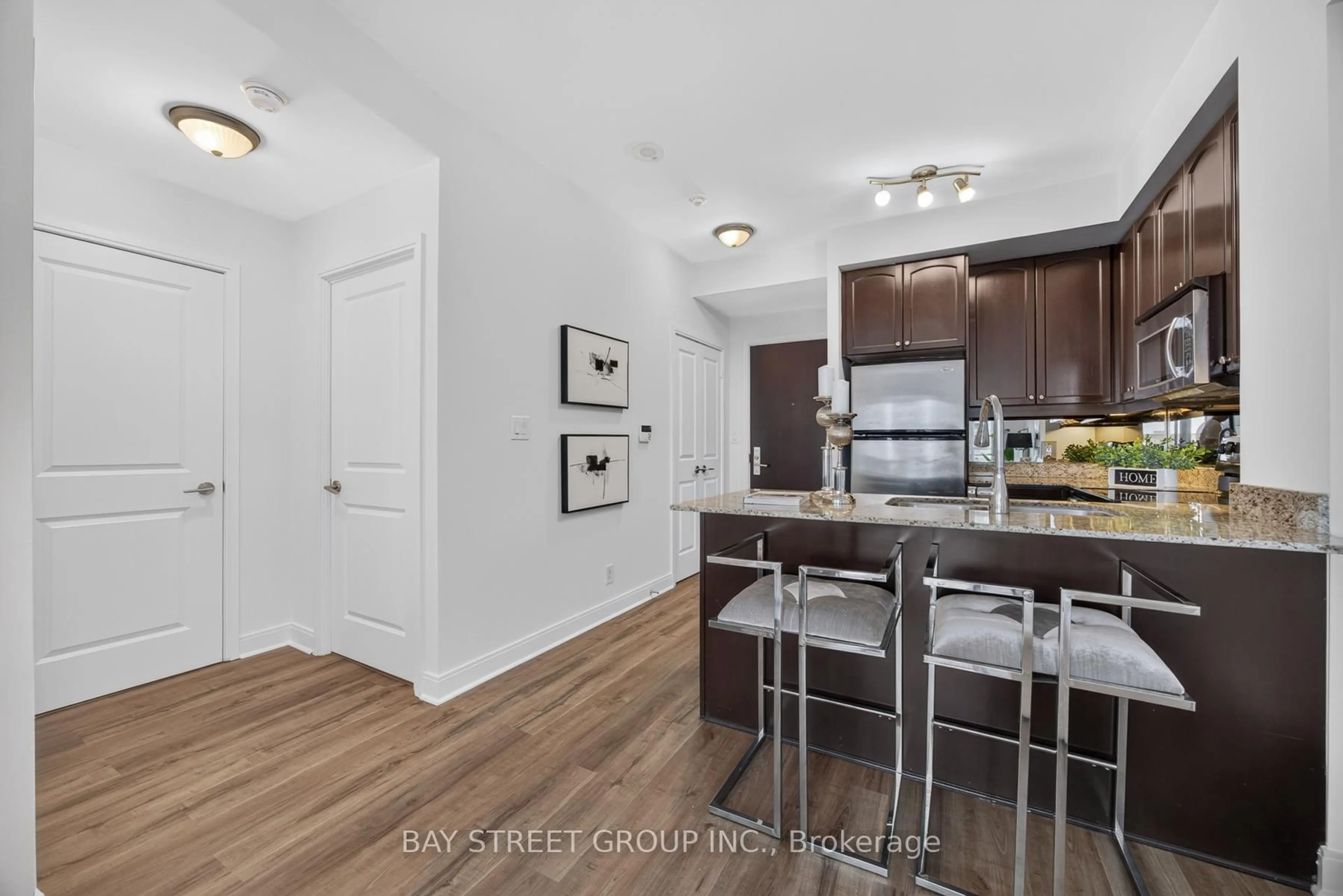 Open concept kitchen, wood/laminate floor for 50 Absolute Ave #1302, Mississauga Ontario L4Z 0A9