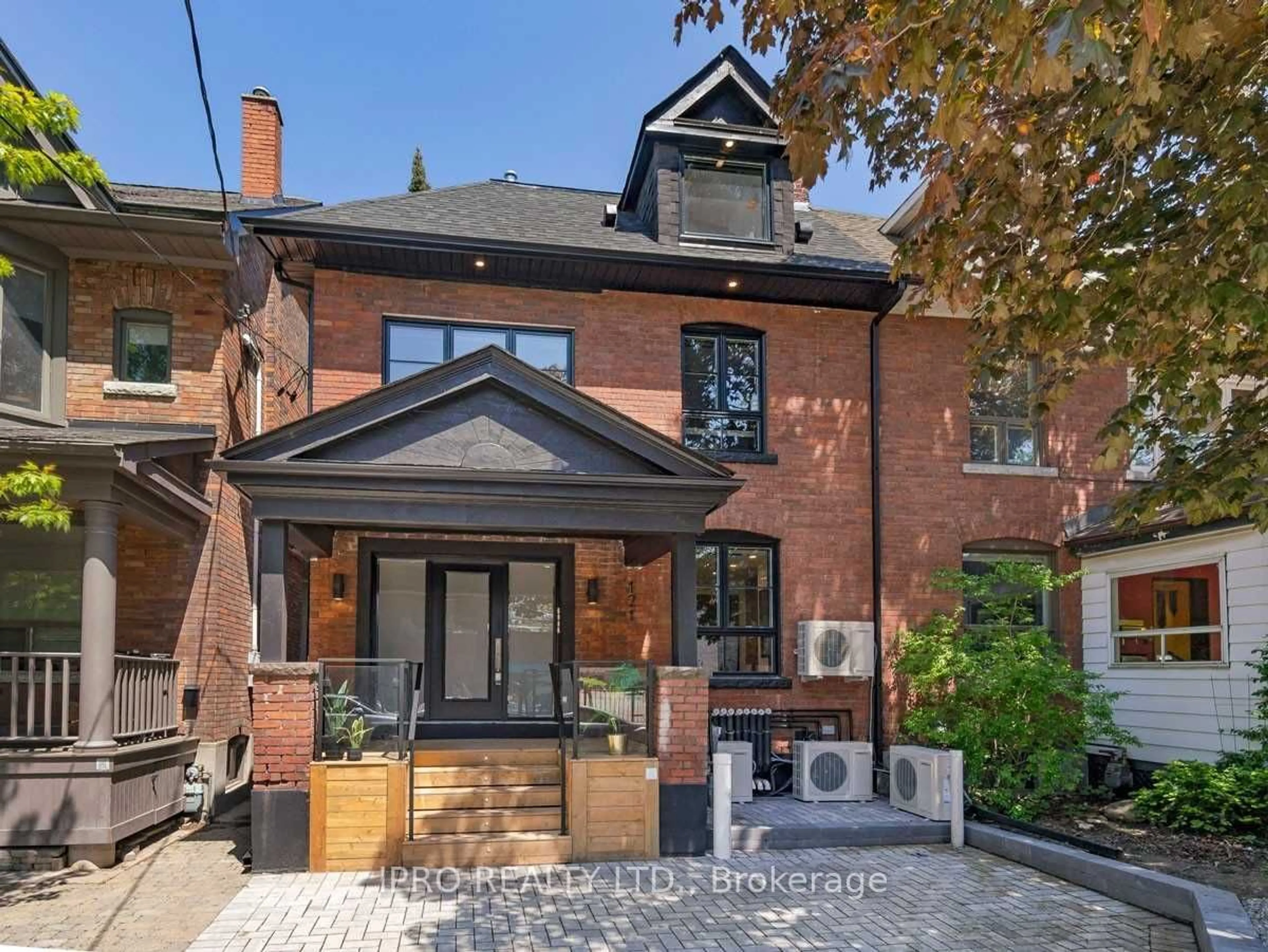 Home with brick exterior material for 121 Sorauren Ave, Toronto Ontario M6R 2E3