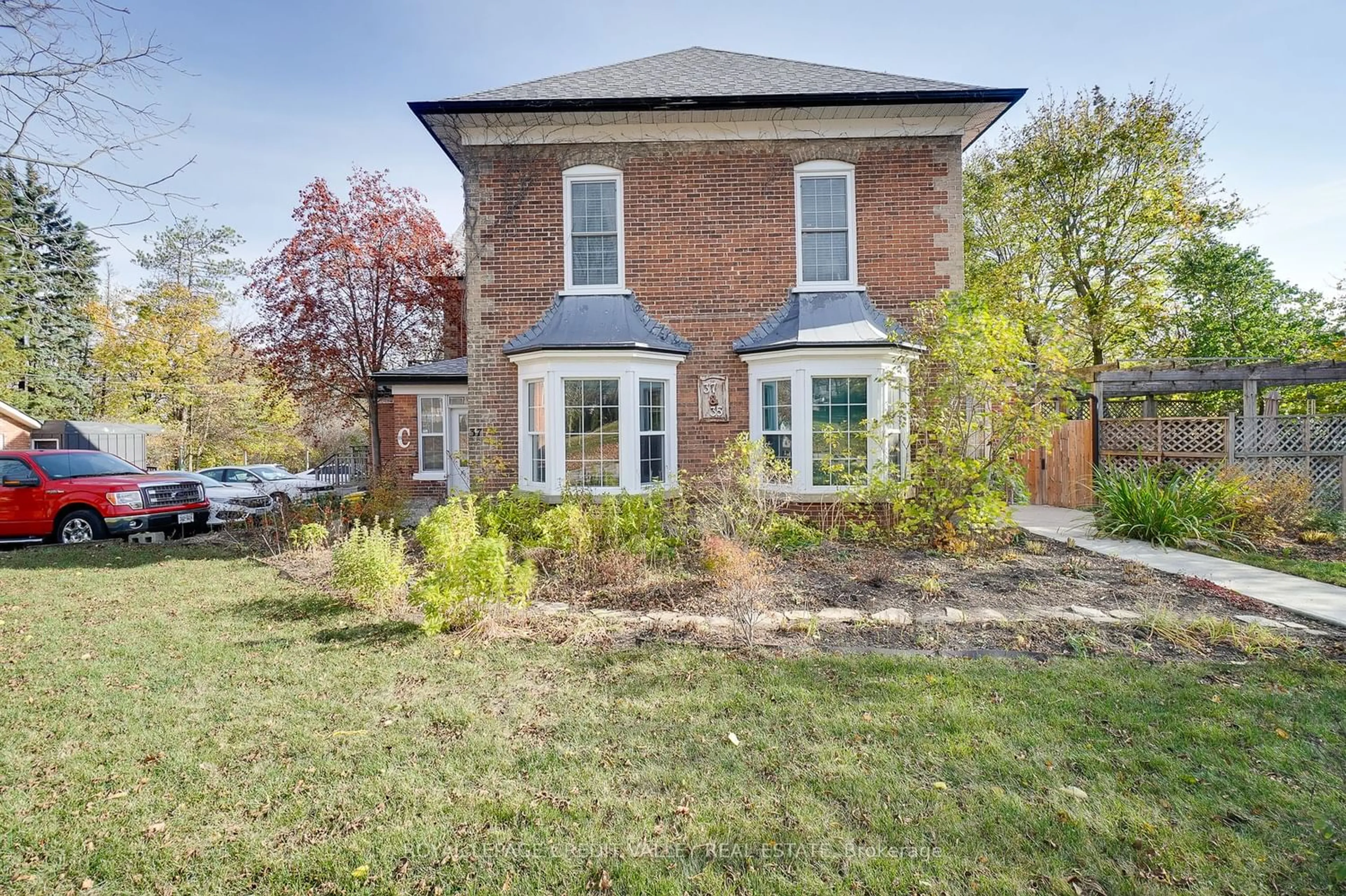 Home with brick exterior material for 35 & 37 First St, Orangeville Ontario L9W 2E3