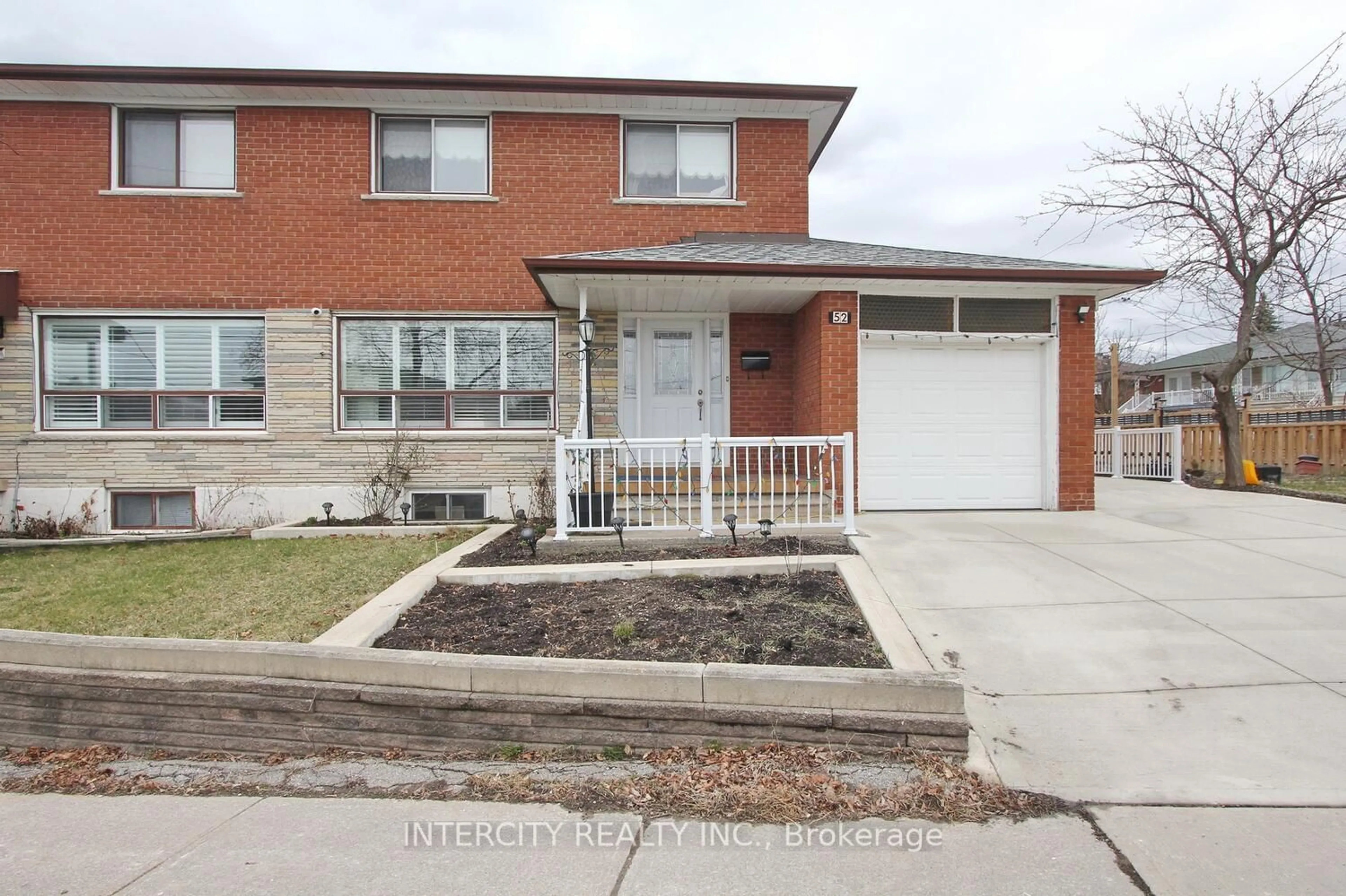 Home with brick exterior material for 52 Ardwick Blvd, Toronto Ontario M9M 1W1