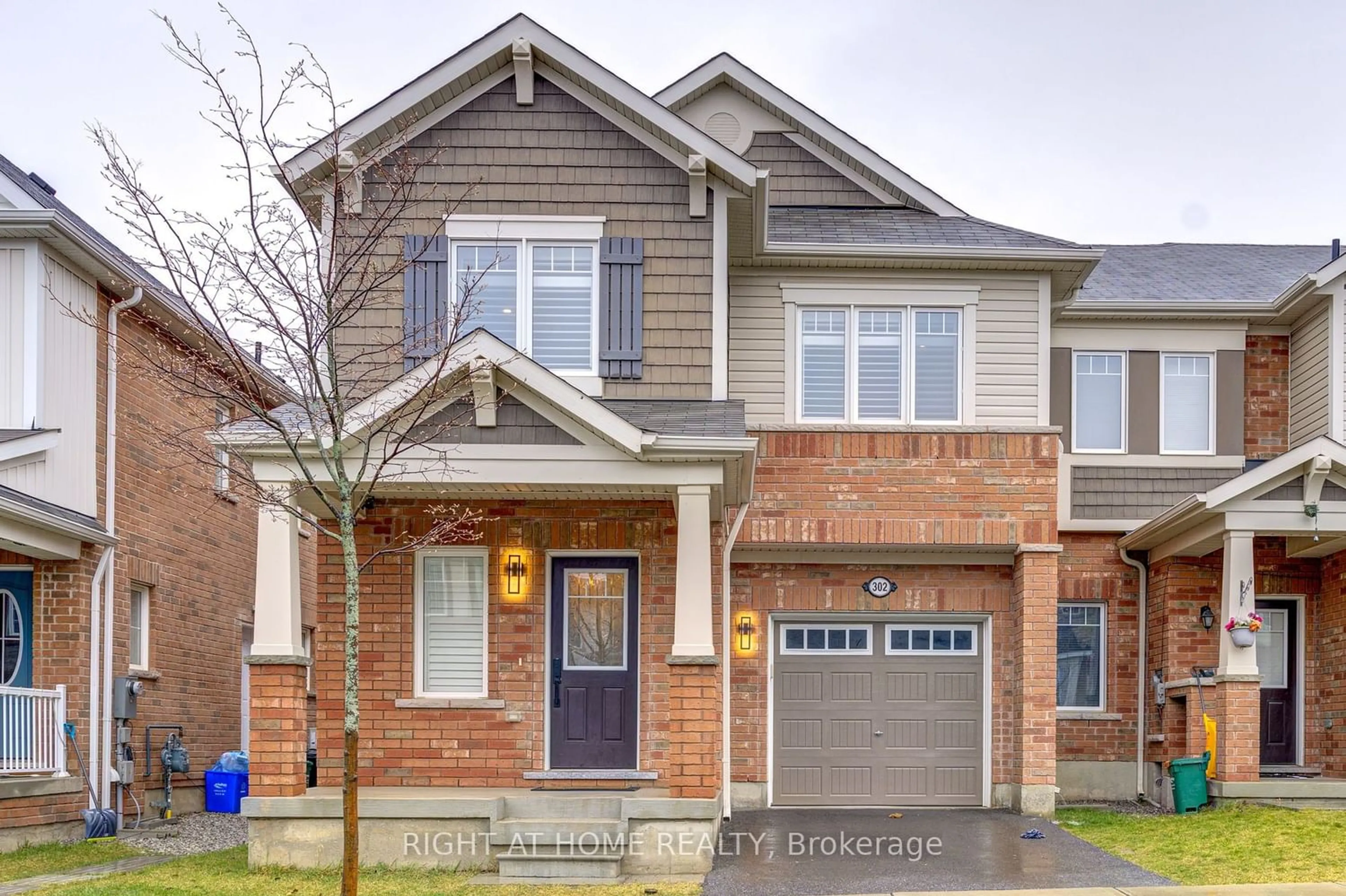 Home with brick exterior material for 302 Jean Landing, Milton Ontario L9E 1C6