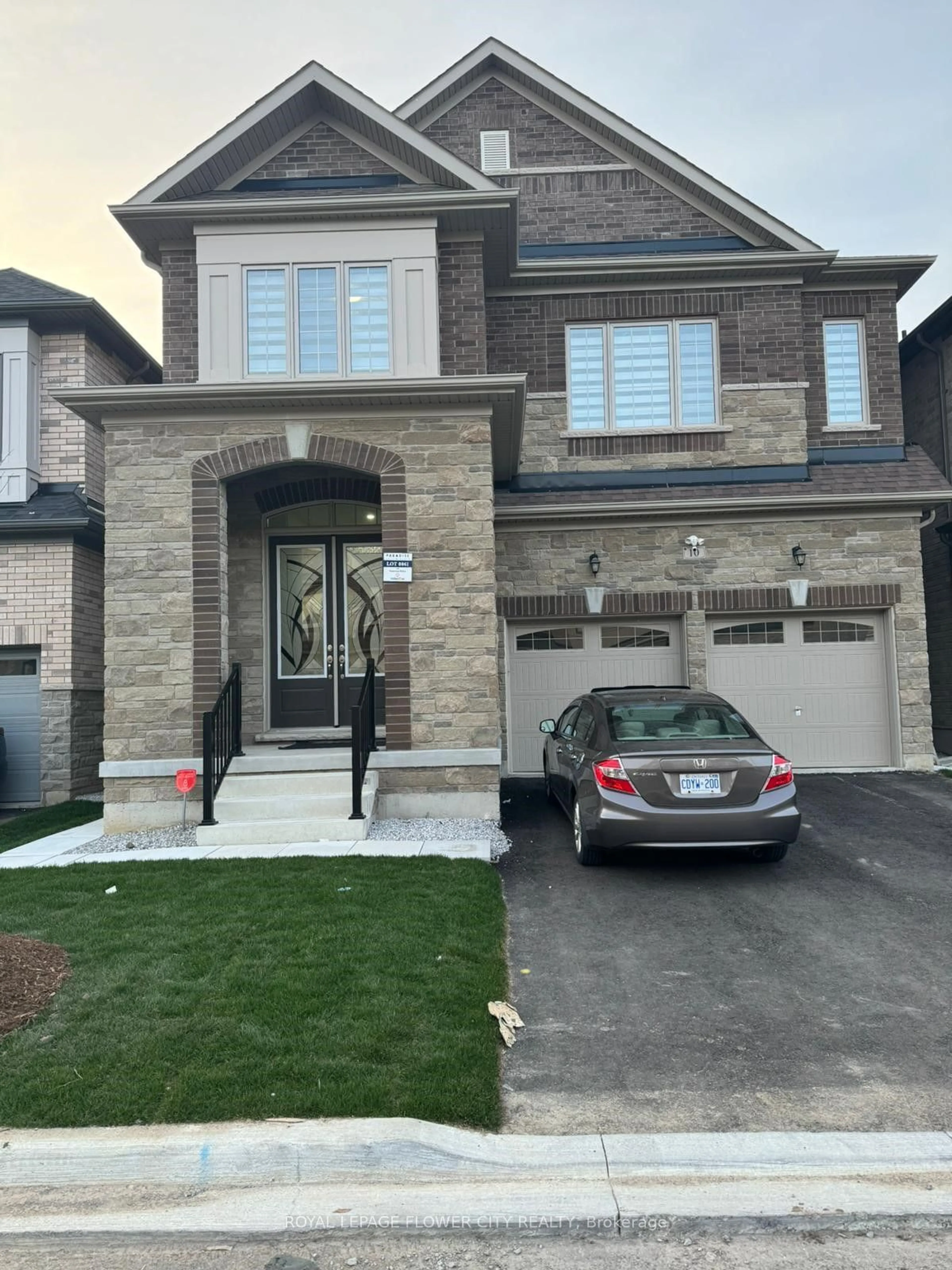 Home with brick exterior material for 10 East Man Dr, Brampton Ontario L6X 5S6