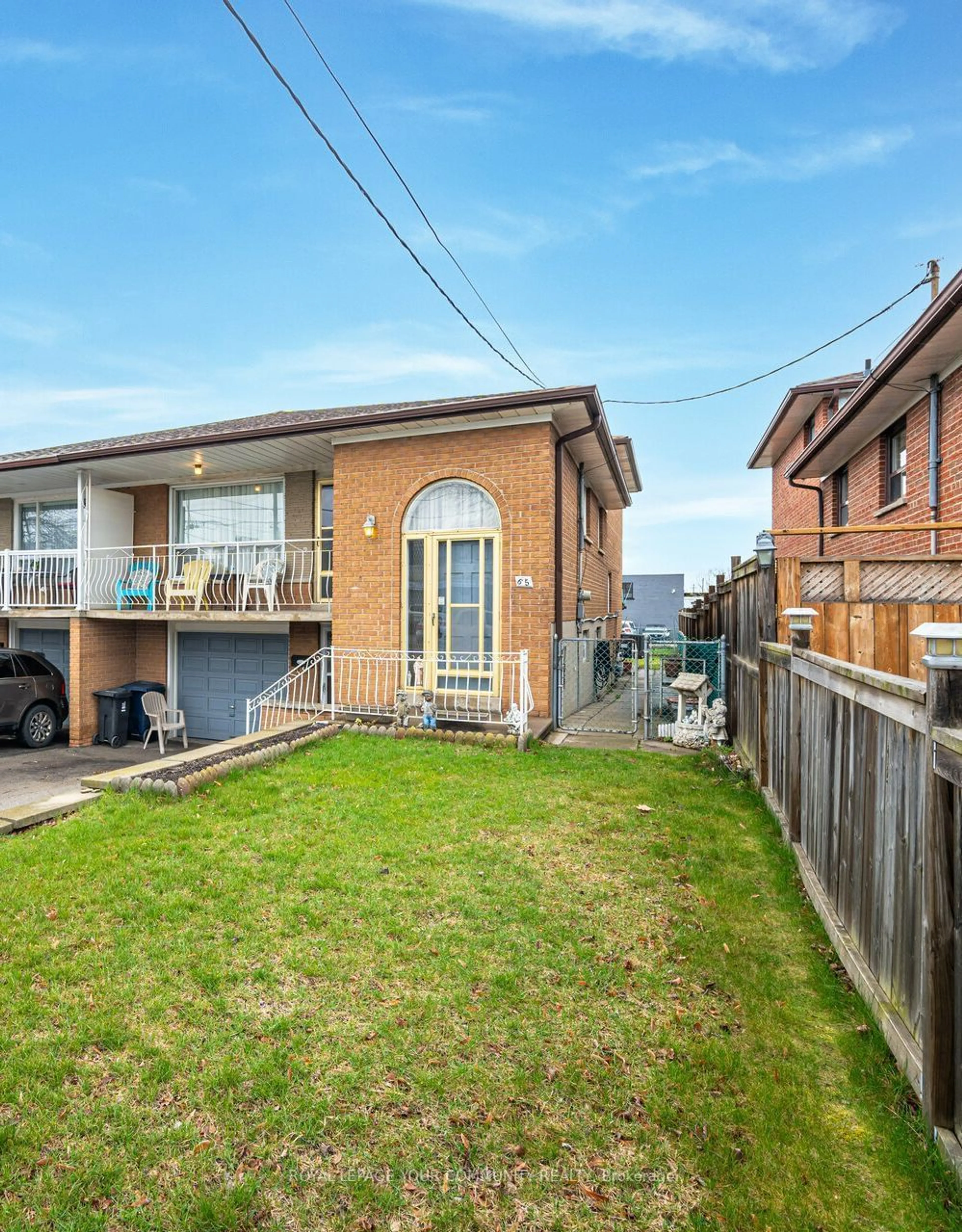 Frontside or backside of a home for 65 Plunkett Rd, Toronto Ontario M9L 2J4