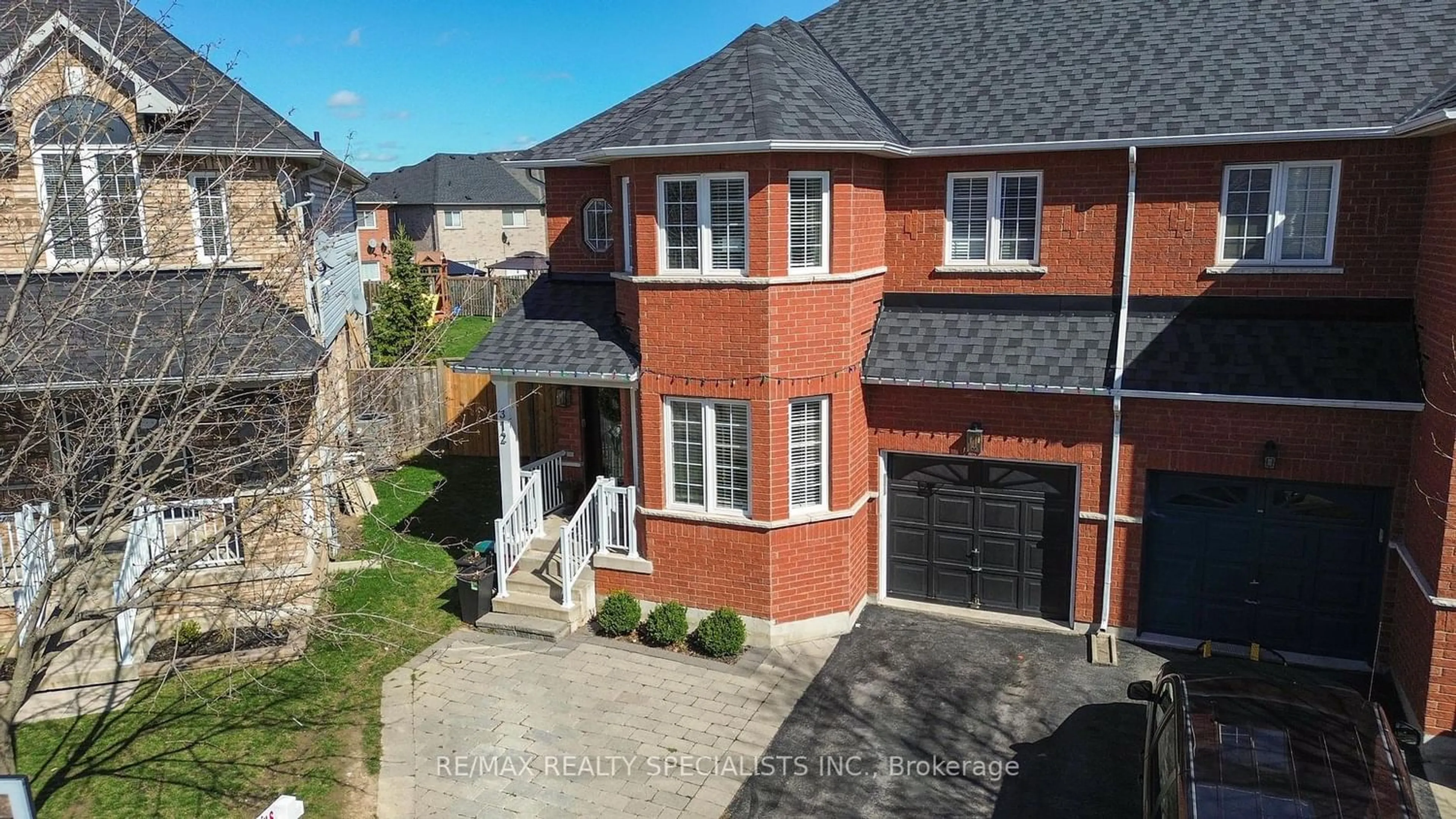 Home with brick exterior material for 312 Fasken Crt, Milton Ontario L9T 6S9