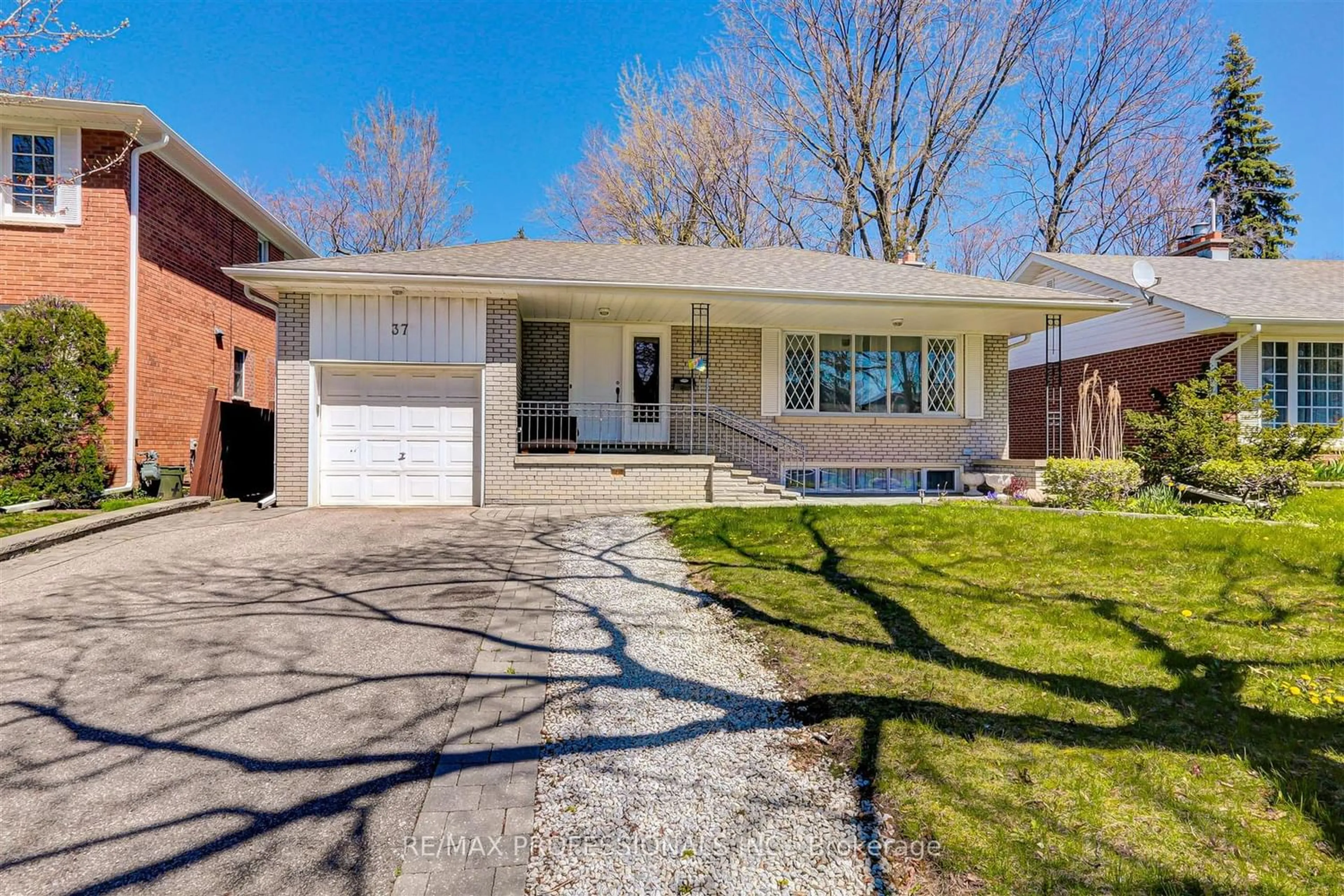 Frontside or backside of a home for 37 Markland Dr, Toronto Ontario M9C 1M9