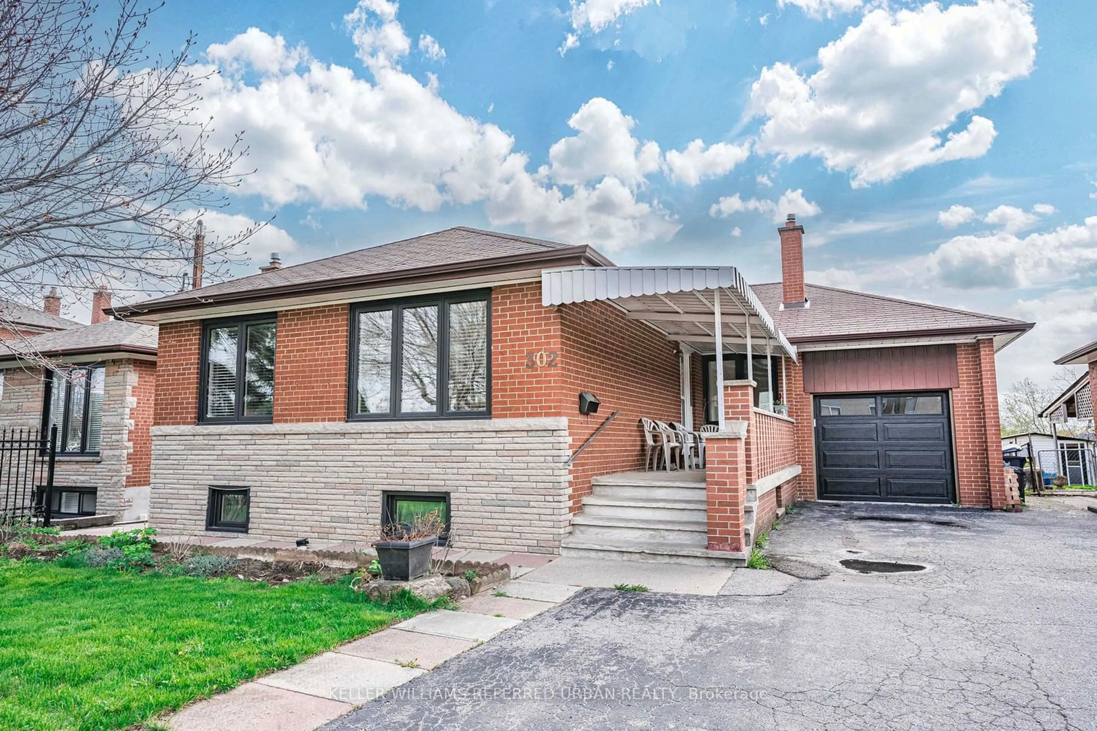 Home with brick exterior material for 302 Culford Rd, Toronto Ontario M6L 2V5