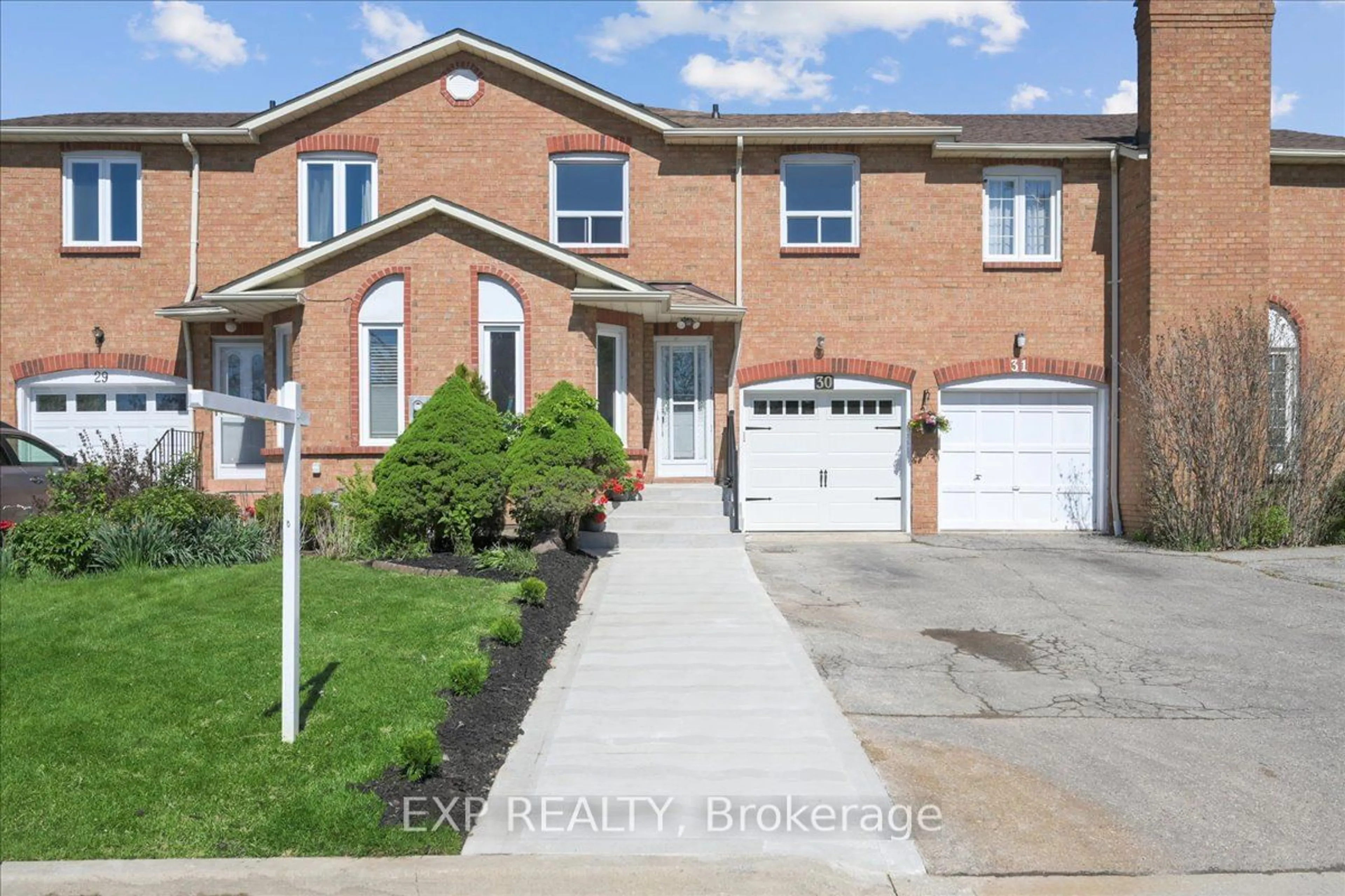 Home with brick exterior material for 365 Tailfeather Cres #30, Mississauga Ontario L4Z 2Z8