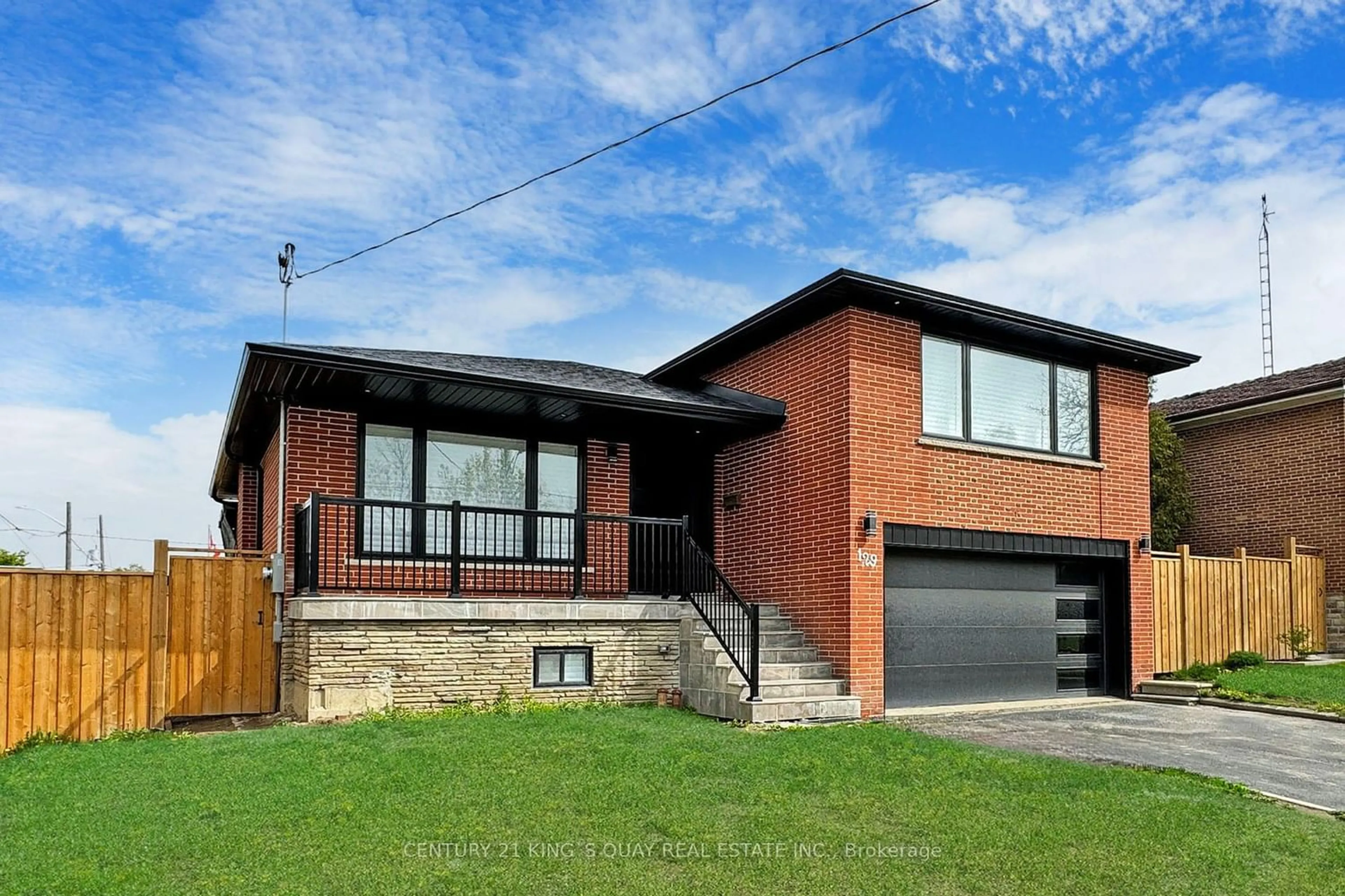 Home with brick exterior material for 129 Exbury Rd, Toronto Ontario M3M 1R5