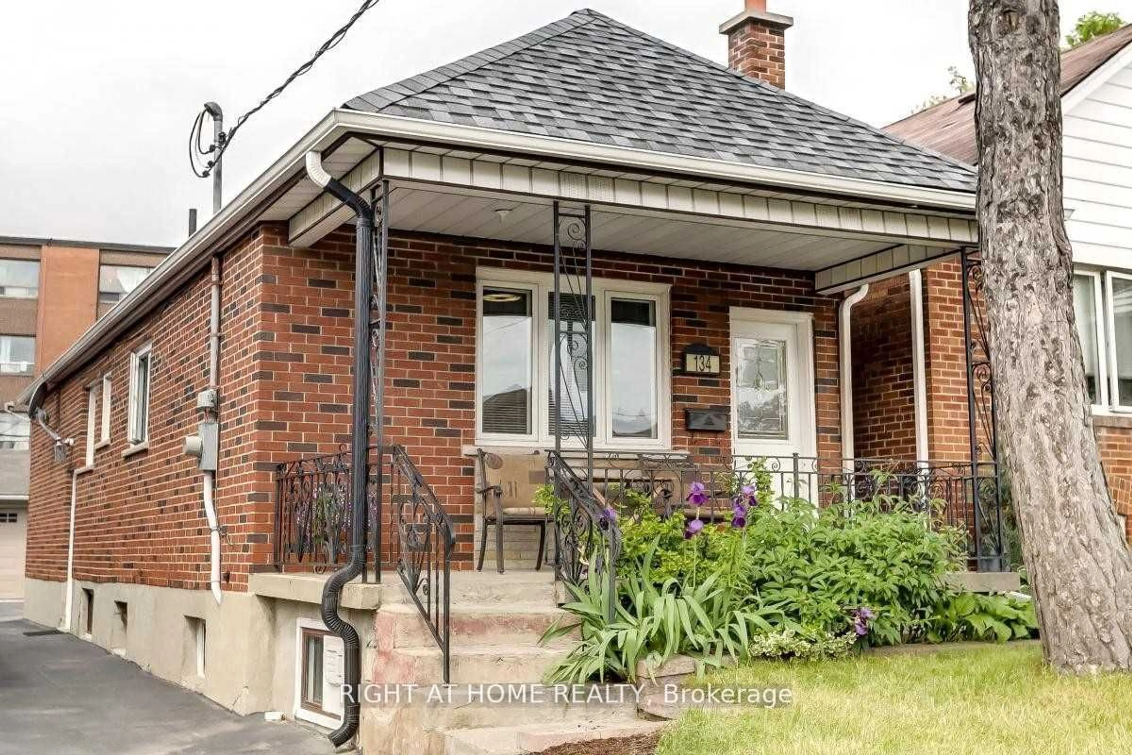 Home with brick exterior material for 134 Locksley Ave, Toronto Ontario M6B 3N5