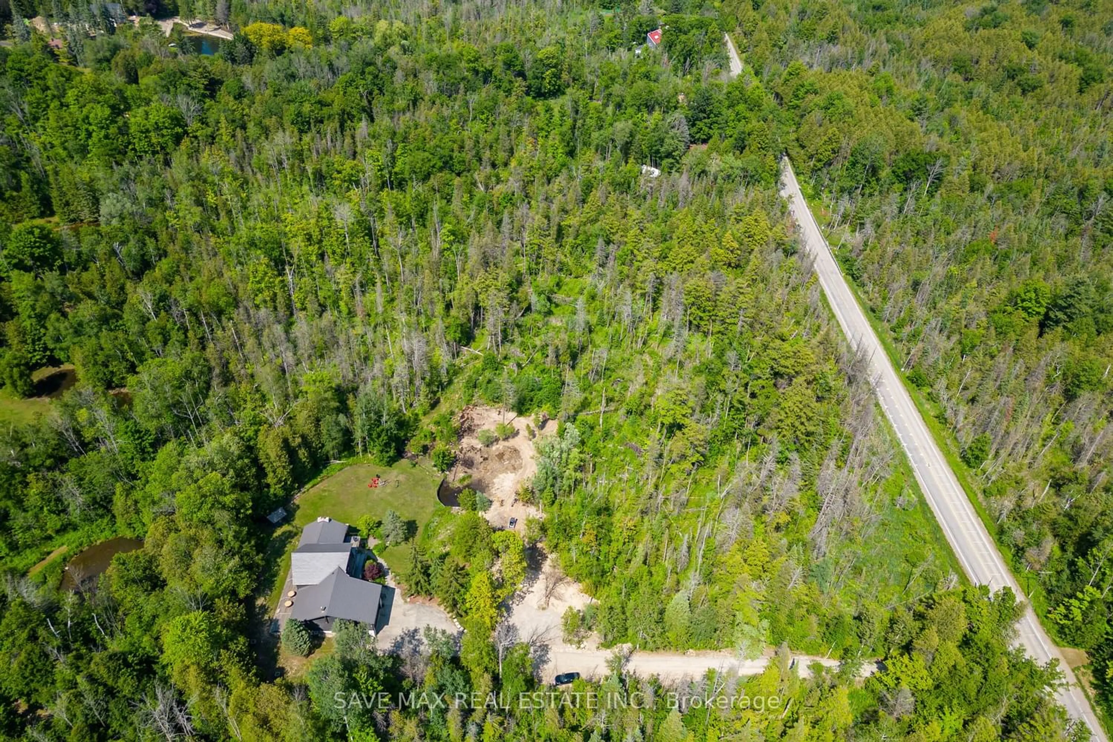 A pic from outside/outdoor area/front of a property/back of a property/a pic from drone, forest/trees view for 2654 Forks Of The Credit Rd, Caledon Ontario L7K 2H5