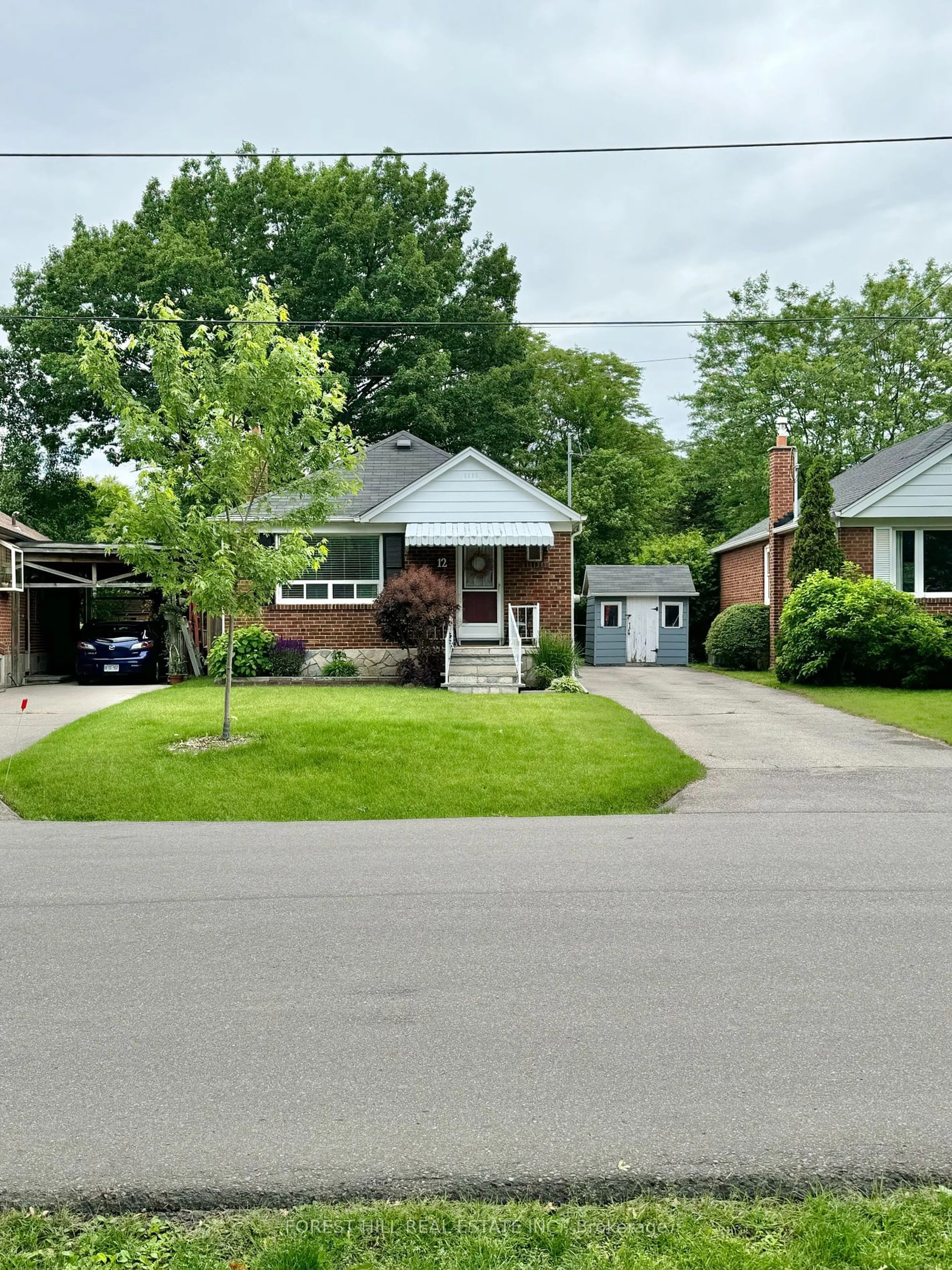 Frontside or backside of a home for 12 Westleigh Cres, Toronto Ontario M8W 3Z7