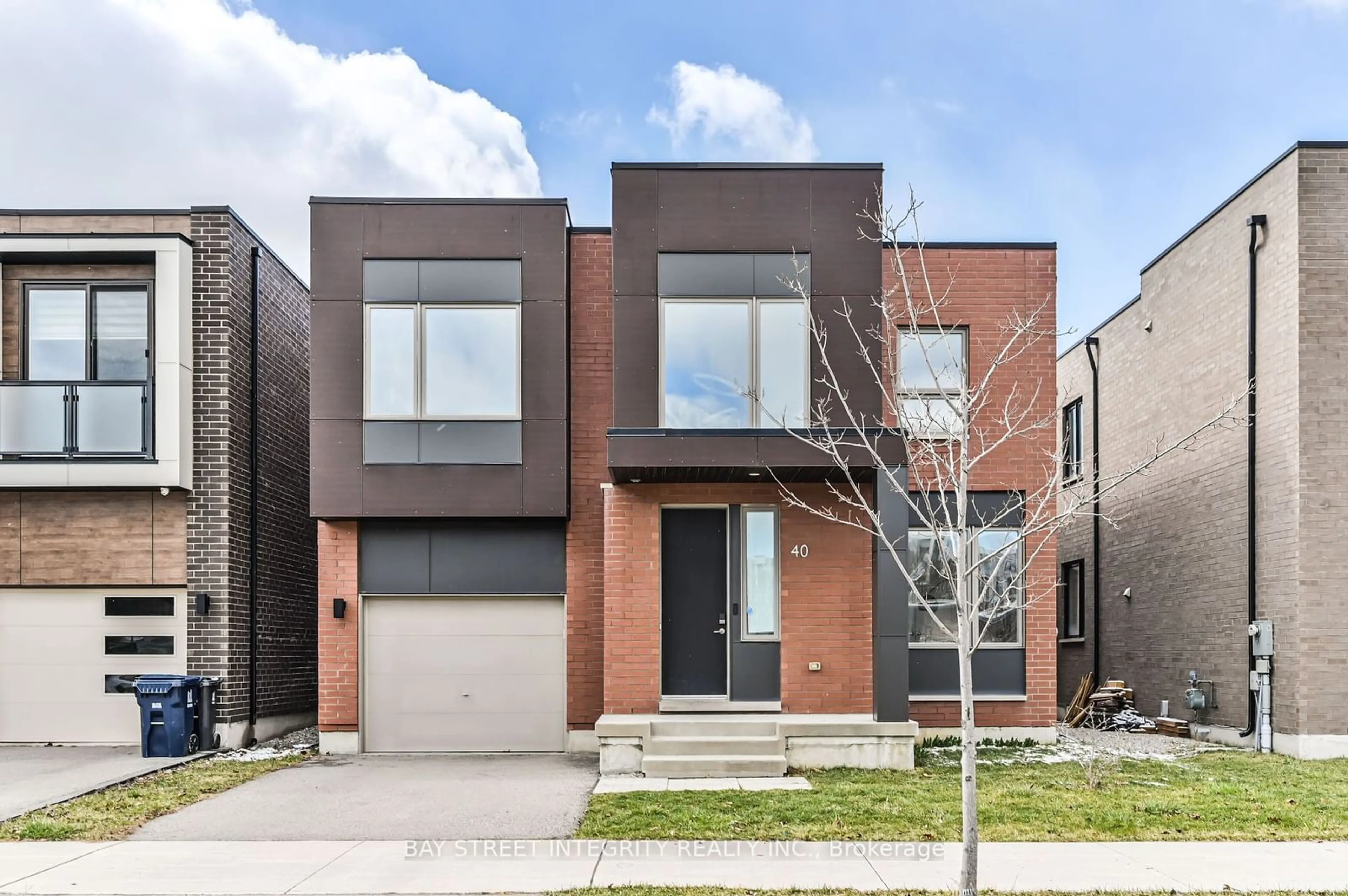 Home with brick exterior material for 40 Stanley Greene Blvd, Toronto Ontario M3K 0A9