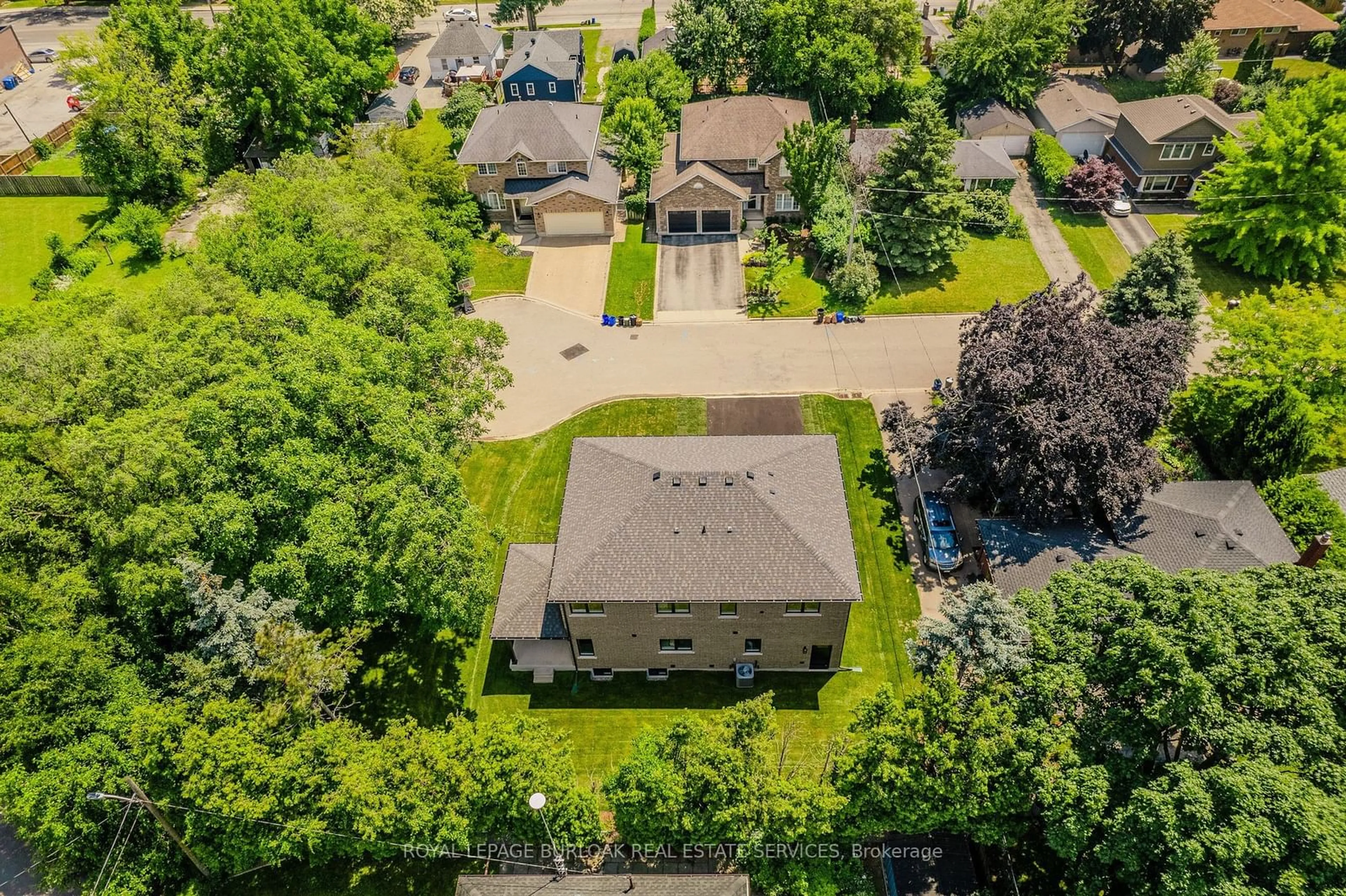 Frontside or backside of a home, the fenced backyard for 2423 Raymore Dr, Burlington Ontario L7R 2B4