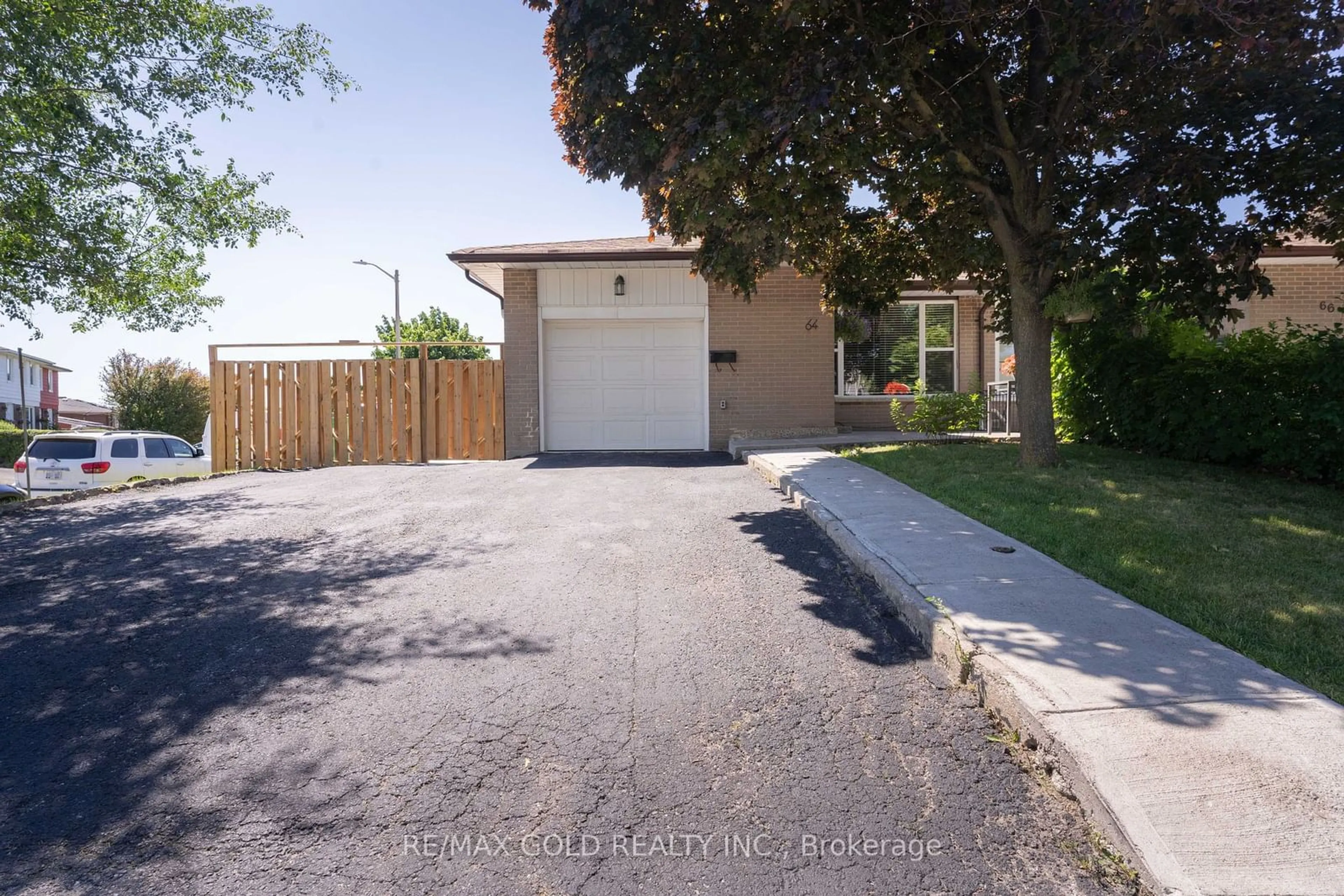 Frontside or backside of a home for 64 Ardglen Dr, Brampton Ontario L6W 1V5