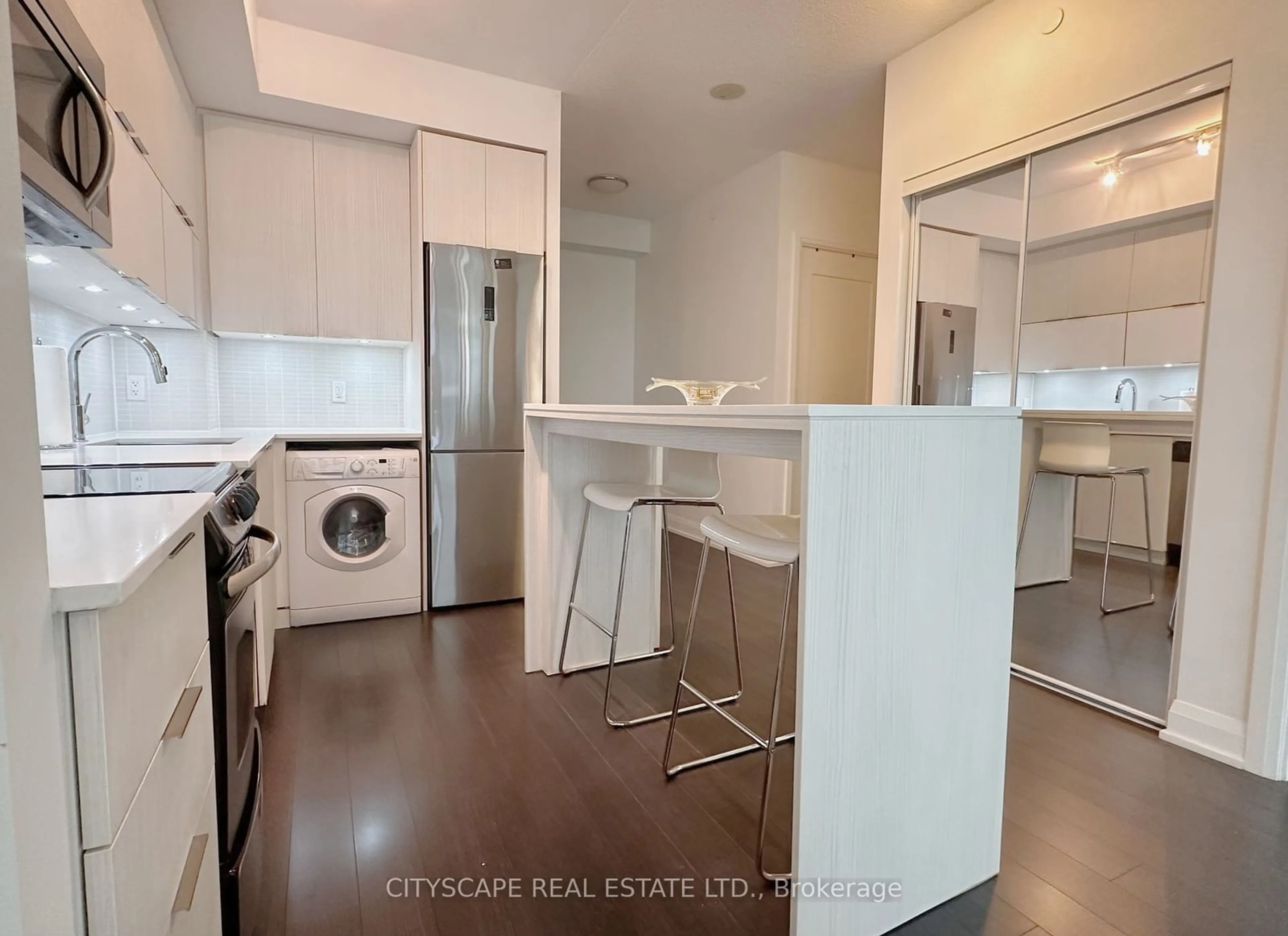 Kitchen with laundary machines for 56 Annie Craig Dr #506, Toronto Ontario M8V 0C8