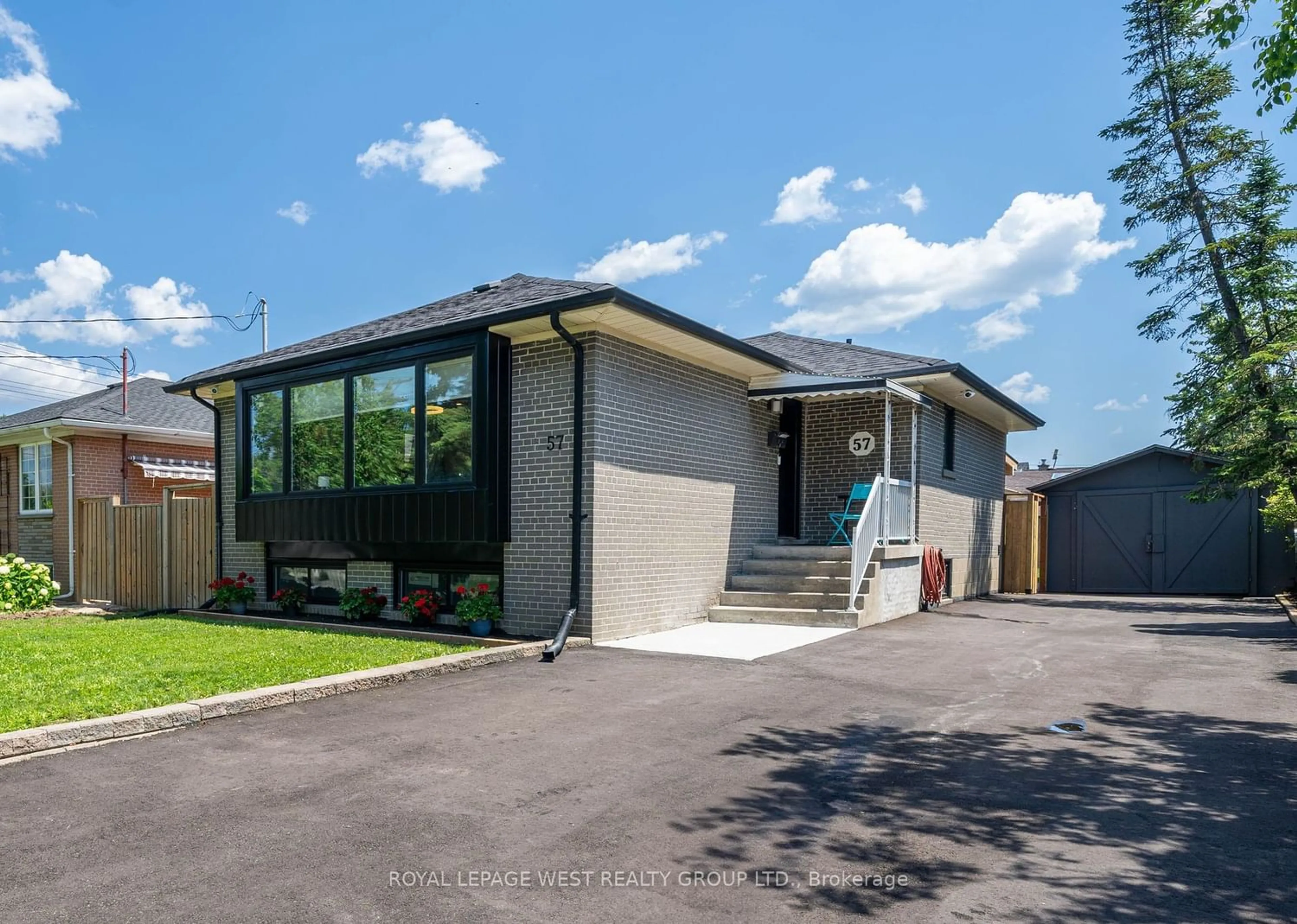 Frontside or backside of a home for 57 Wellesworth Dr, Toronto Ontario M9C 4R2