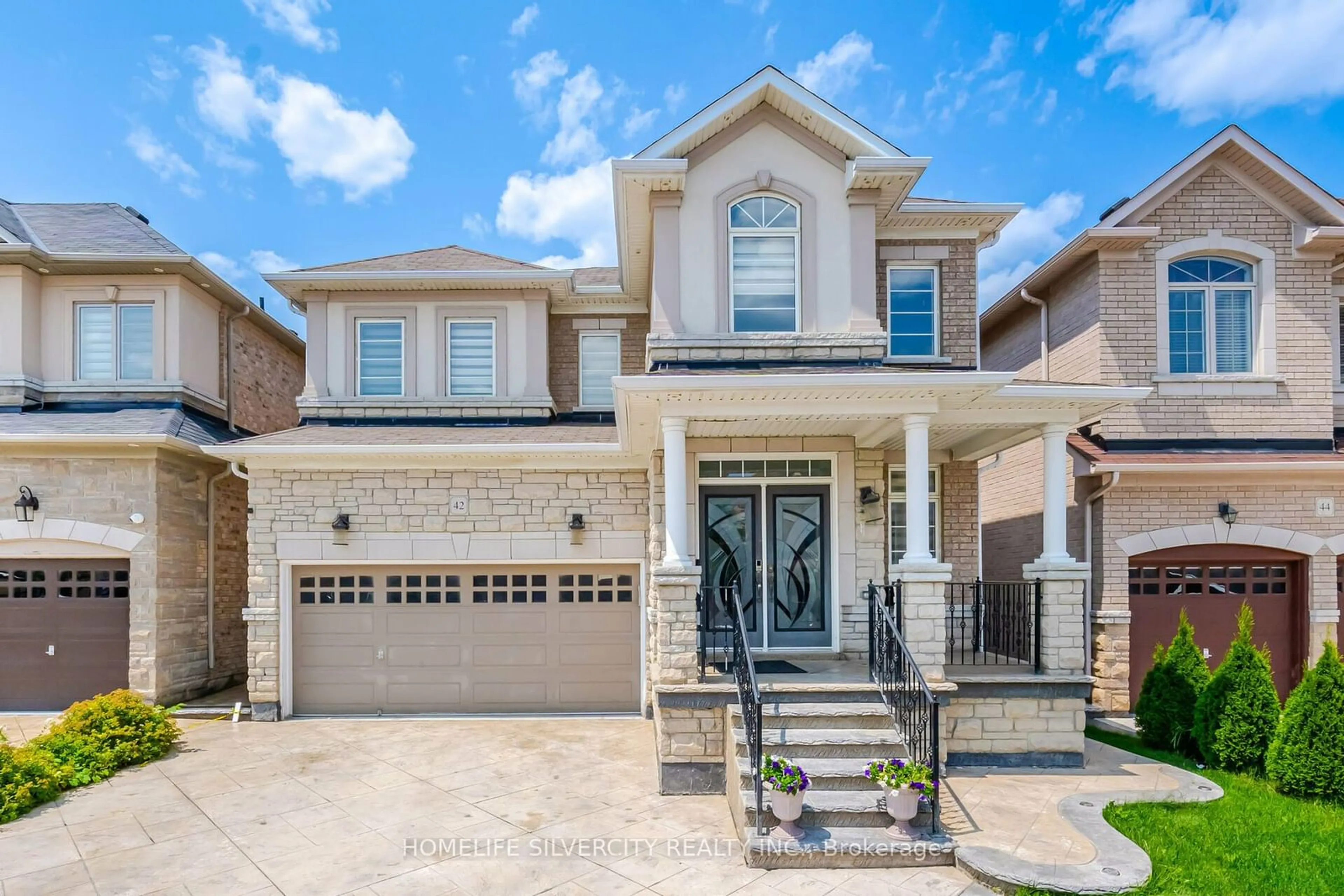 Home with brick exterior material for 42 Levendale Crt, Brampton Ontario L6P 3Y1