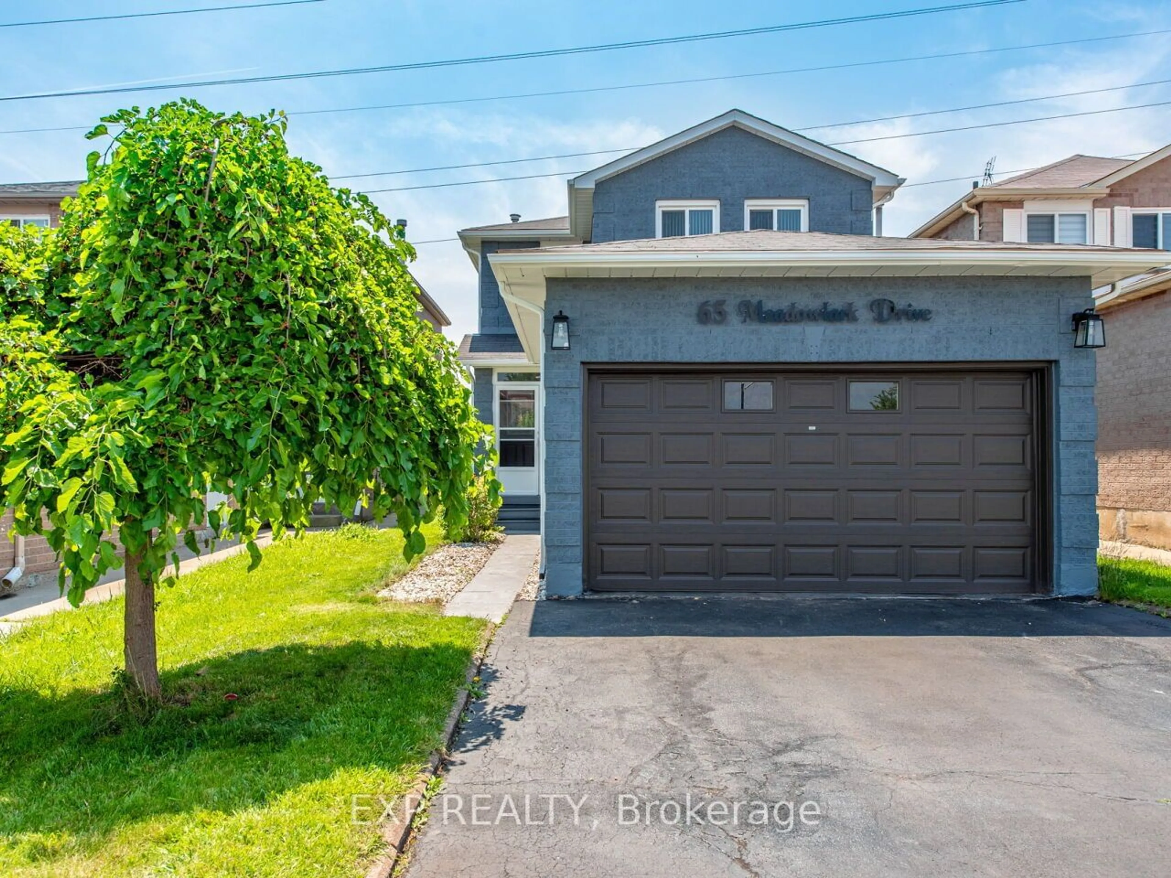 Frontside or backside of a home for 65 Meadowlark Dr, Brampton Ontario L6Y 4A3