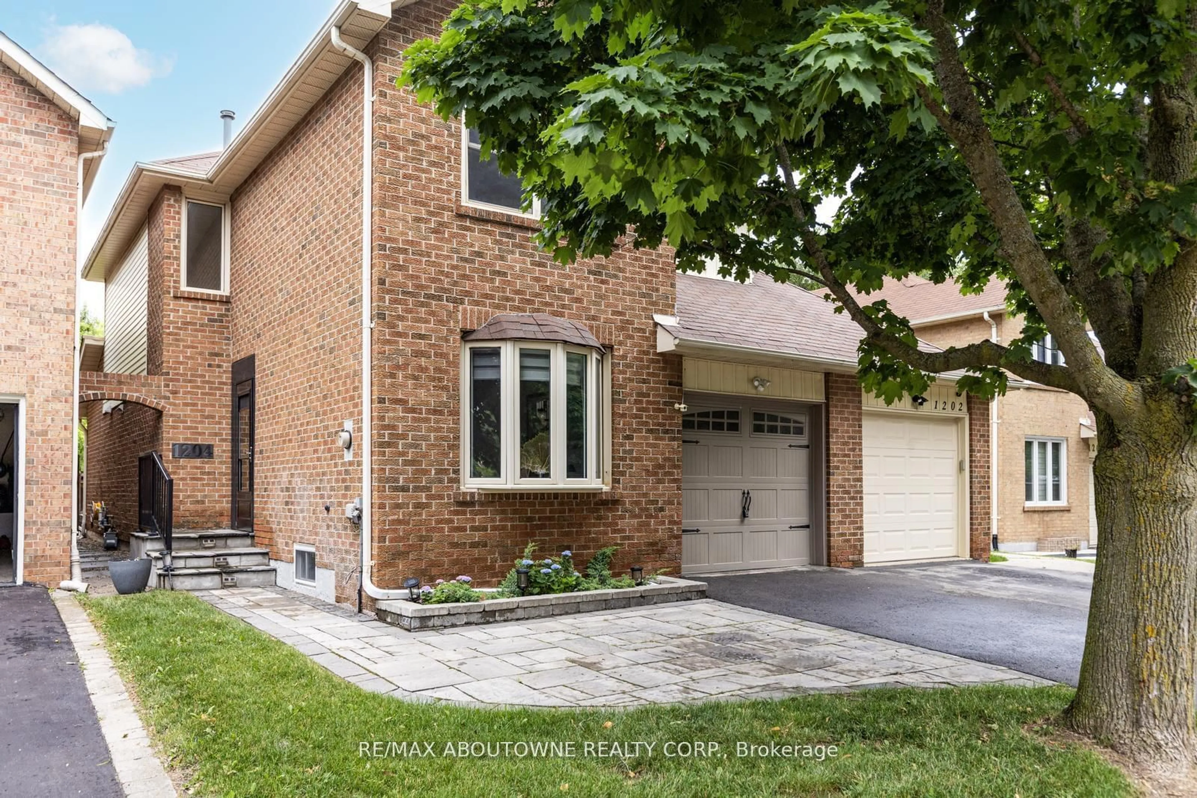 Home with brick exterior material for 1204 Potters Wheel Cres, Oakville Ontario L6M 1J2