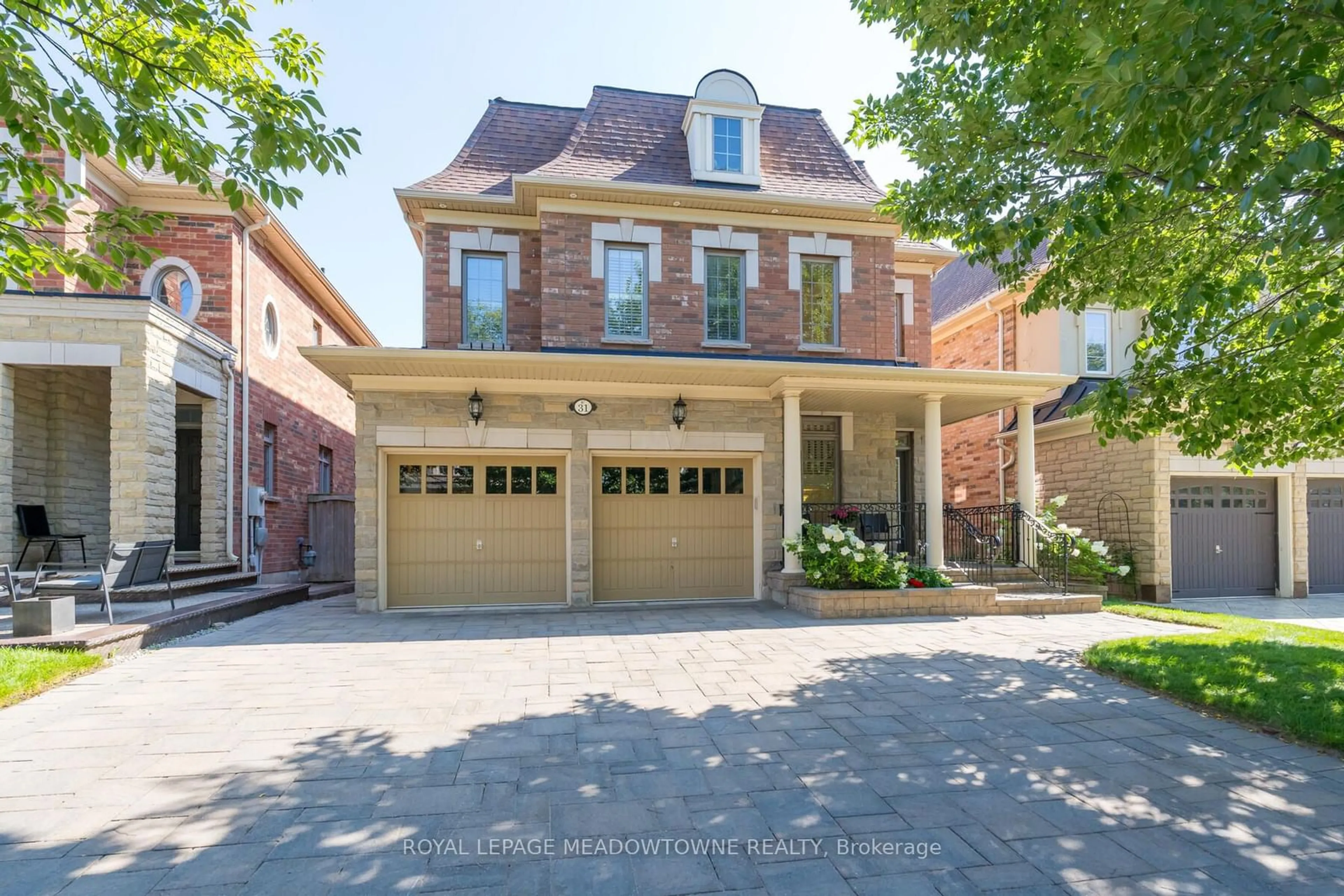 Home with brick exterior material for 31 Intrigue Tr, Brampton Ontario L6X 0X8