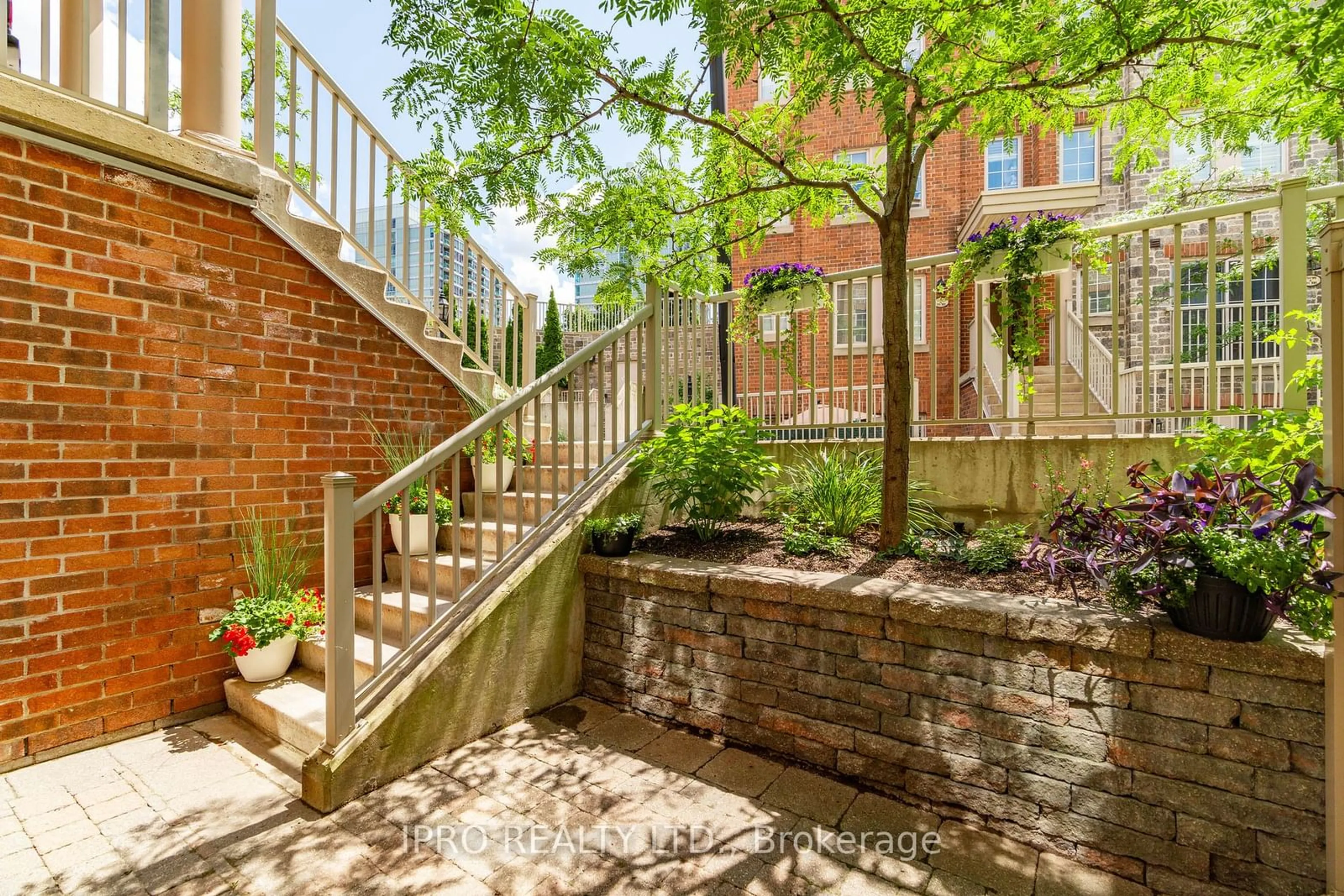 Patio, the fenced backyard for 93 The Queensway #54, Toronto Ontario M6S 5A7