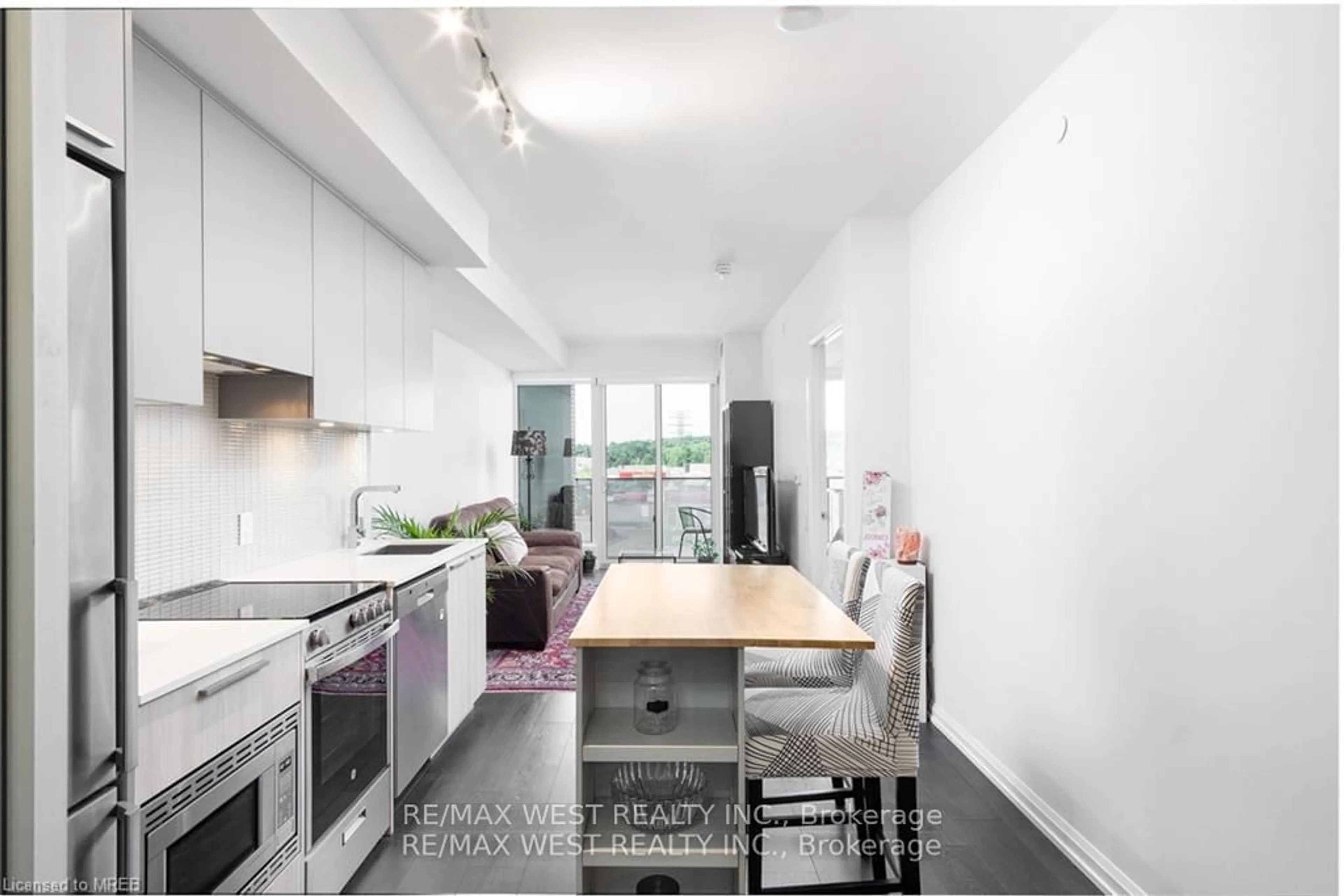 Kitchen, wood floors, the street view for 4208 Dundas St #315, Toronto Ontario M8X 0B1