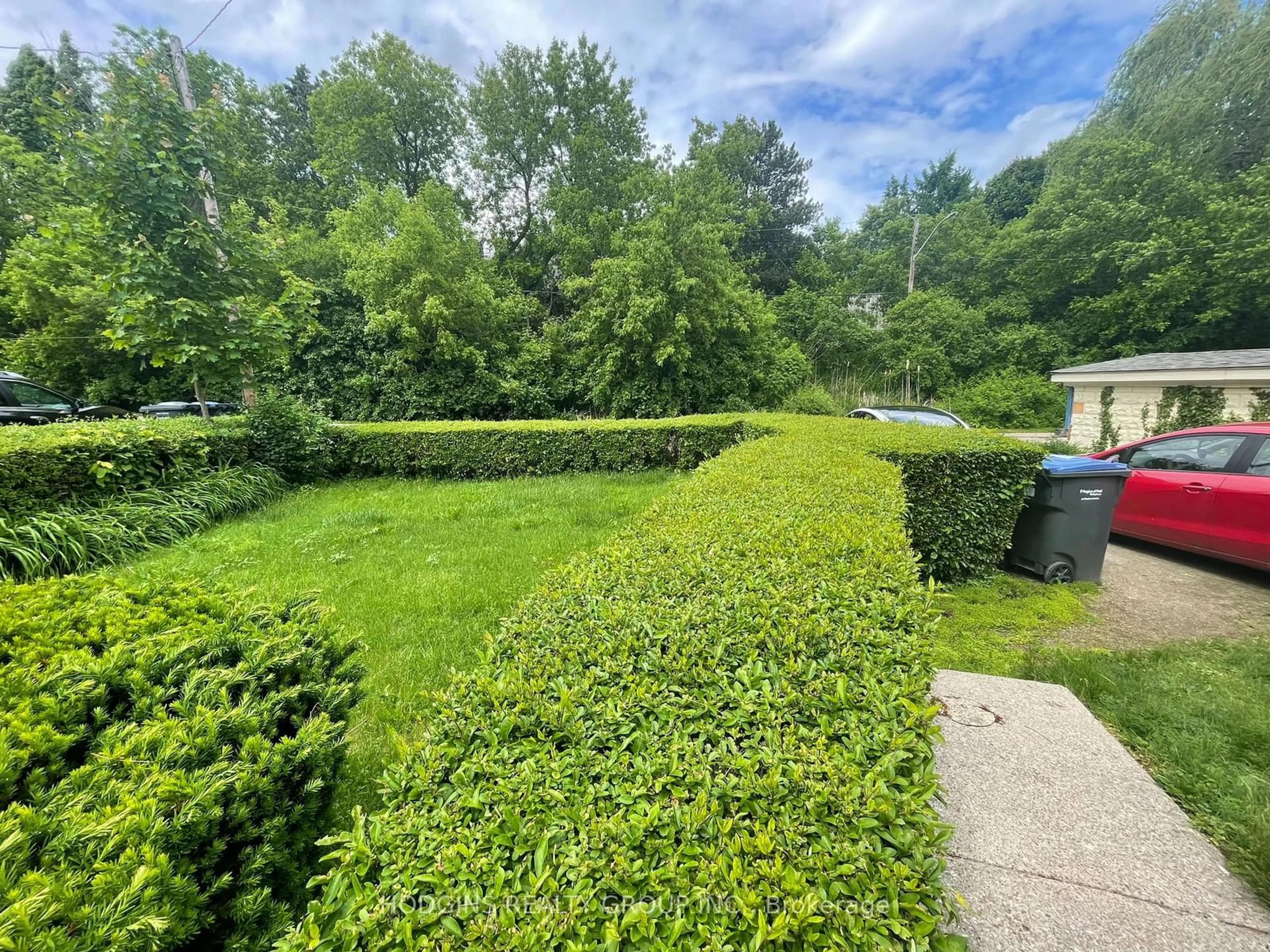 A pic from exterior of the house or condo, the fenced backyard for 63 River Rd, Brampton Ontario L6X 0A8