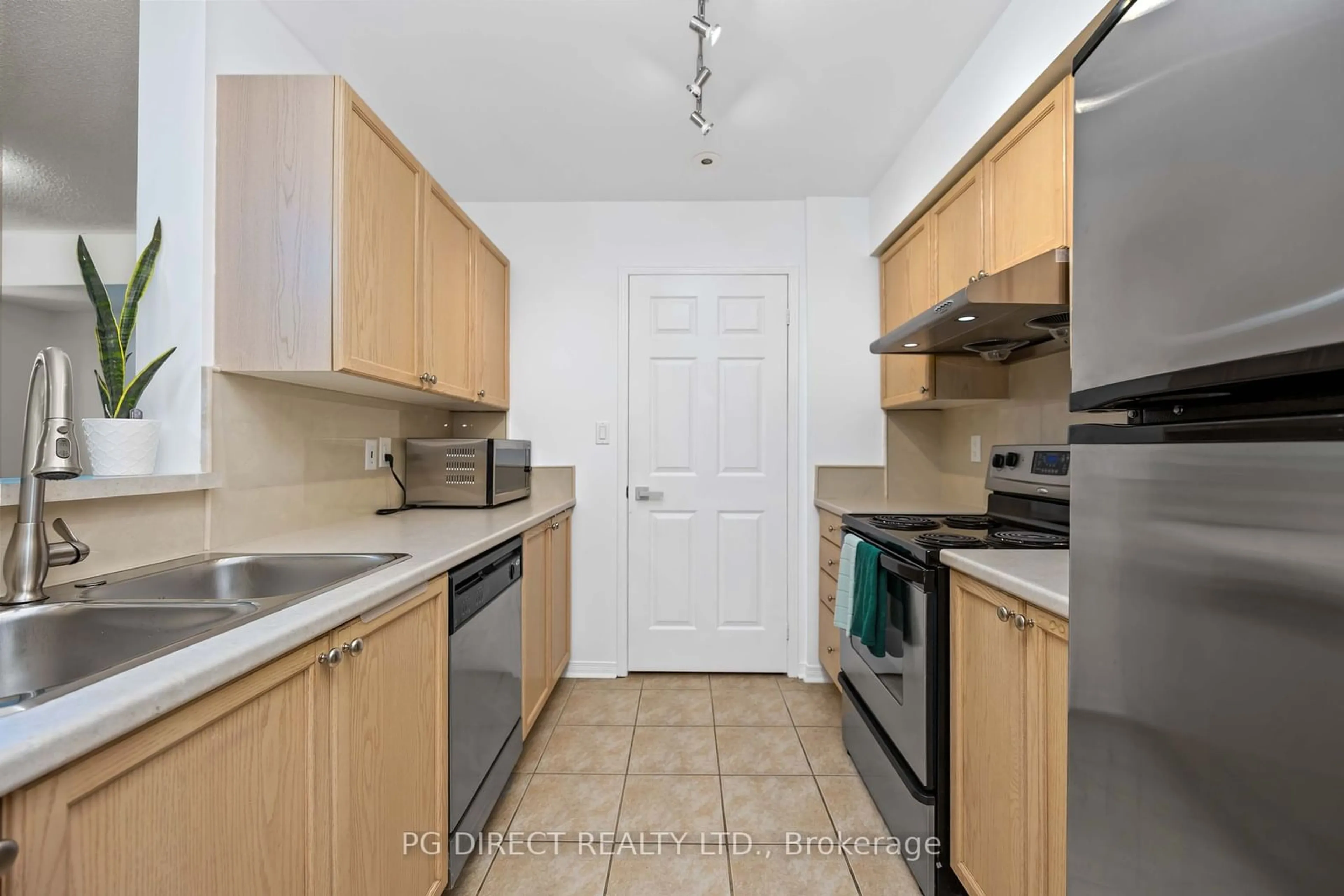 Standard kitchen, not visible floor, the street view for 50 Turntable Cres #57, Toronto Ontario M6H 4K8