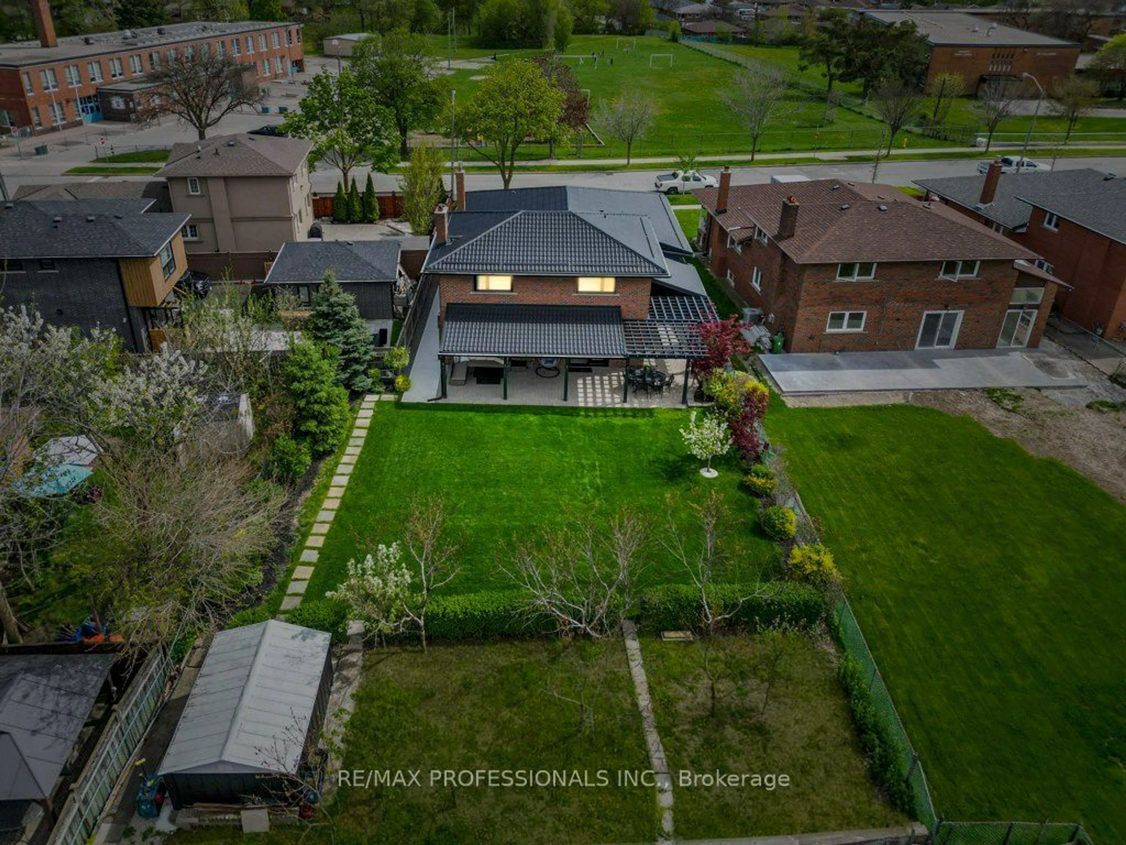 Frontside or backside of a home, the fenced backyard for 182 Gracefield Ave, Toronto Ontario M6L 1L8