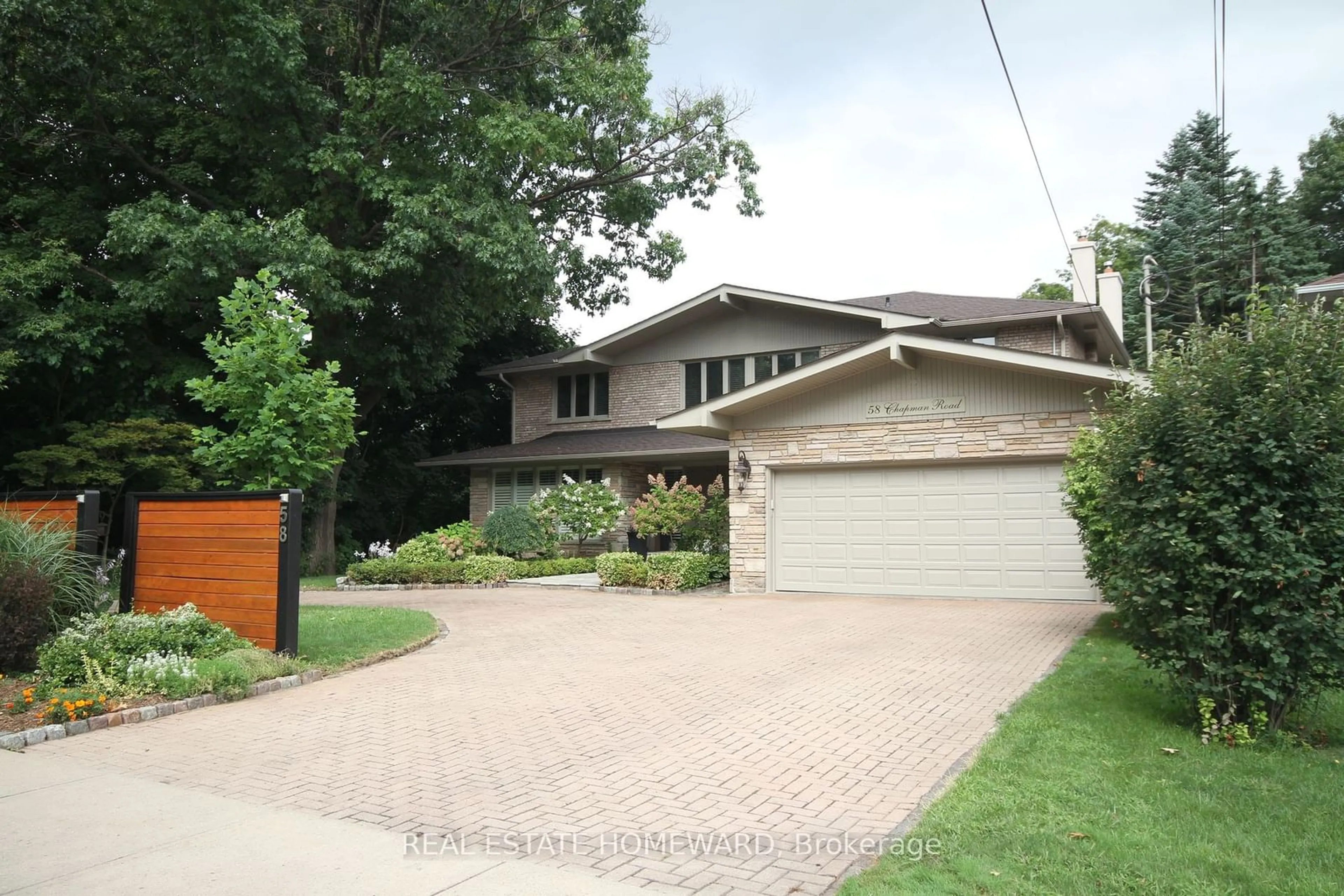 Frontside or backside of a home, the street view for 58 Chapman Rd, Toronto Ontario M9P 1E7