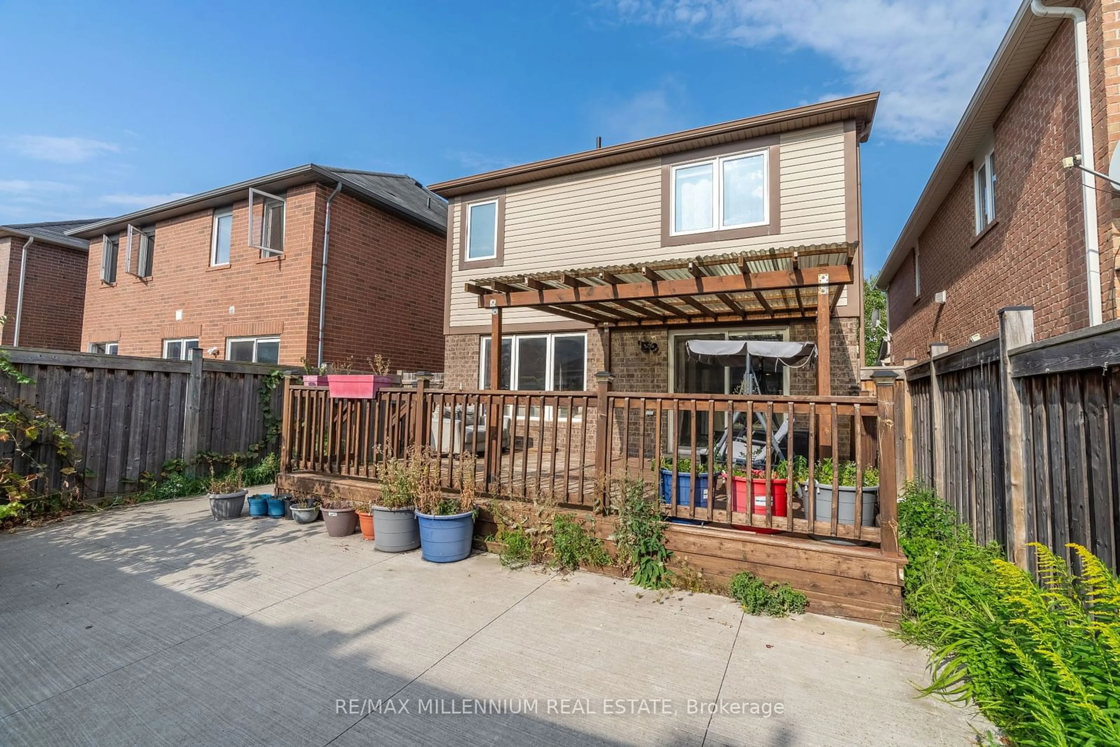 Frontside or backside of a home, the fenced backyard for 41 Lathbury St, Brampton Ontario L7A 0R8