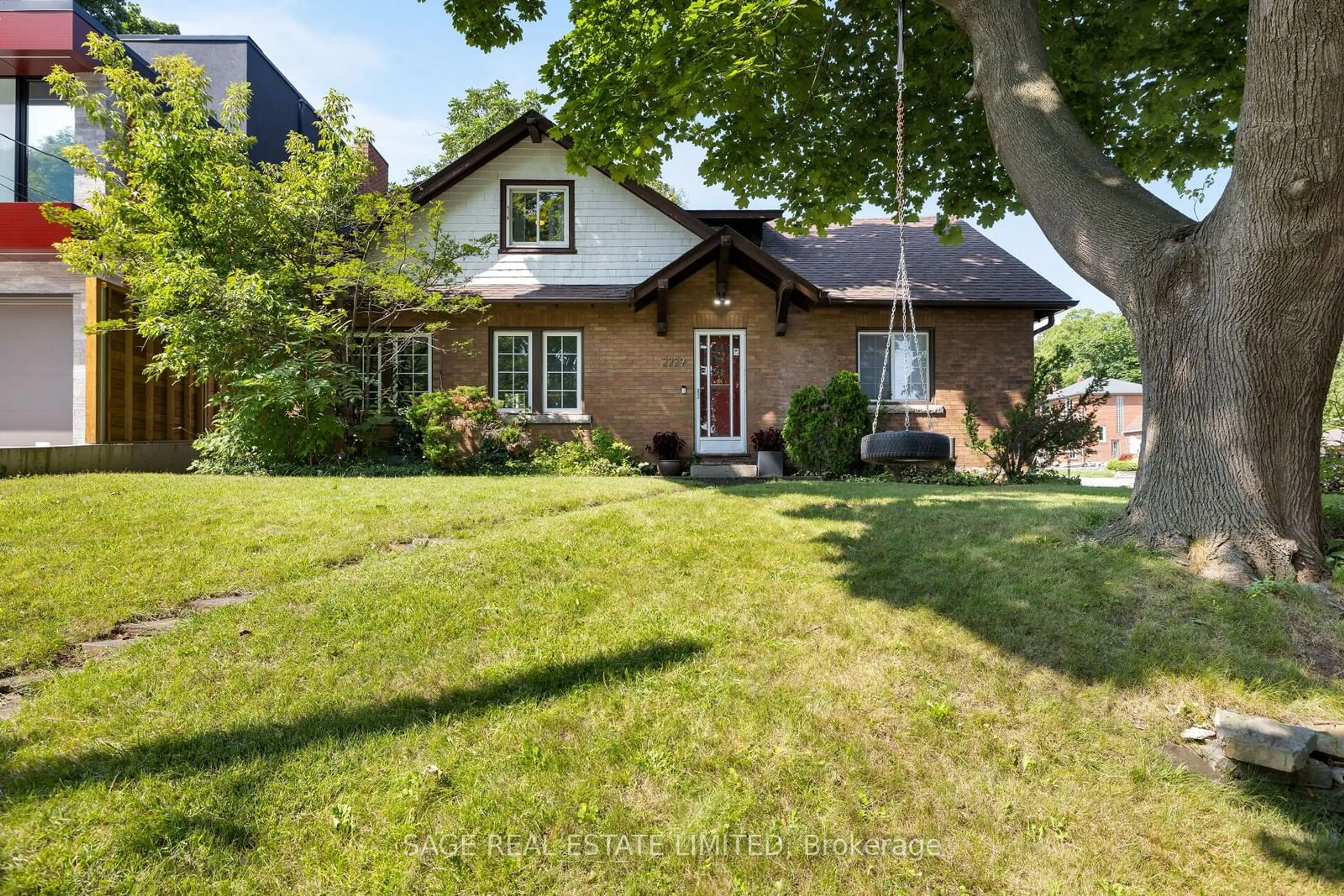 Frontside or backside of a home, cottage for 2229 Lawrence Ave, Toronto Ontario M9P 2A2