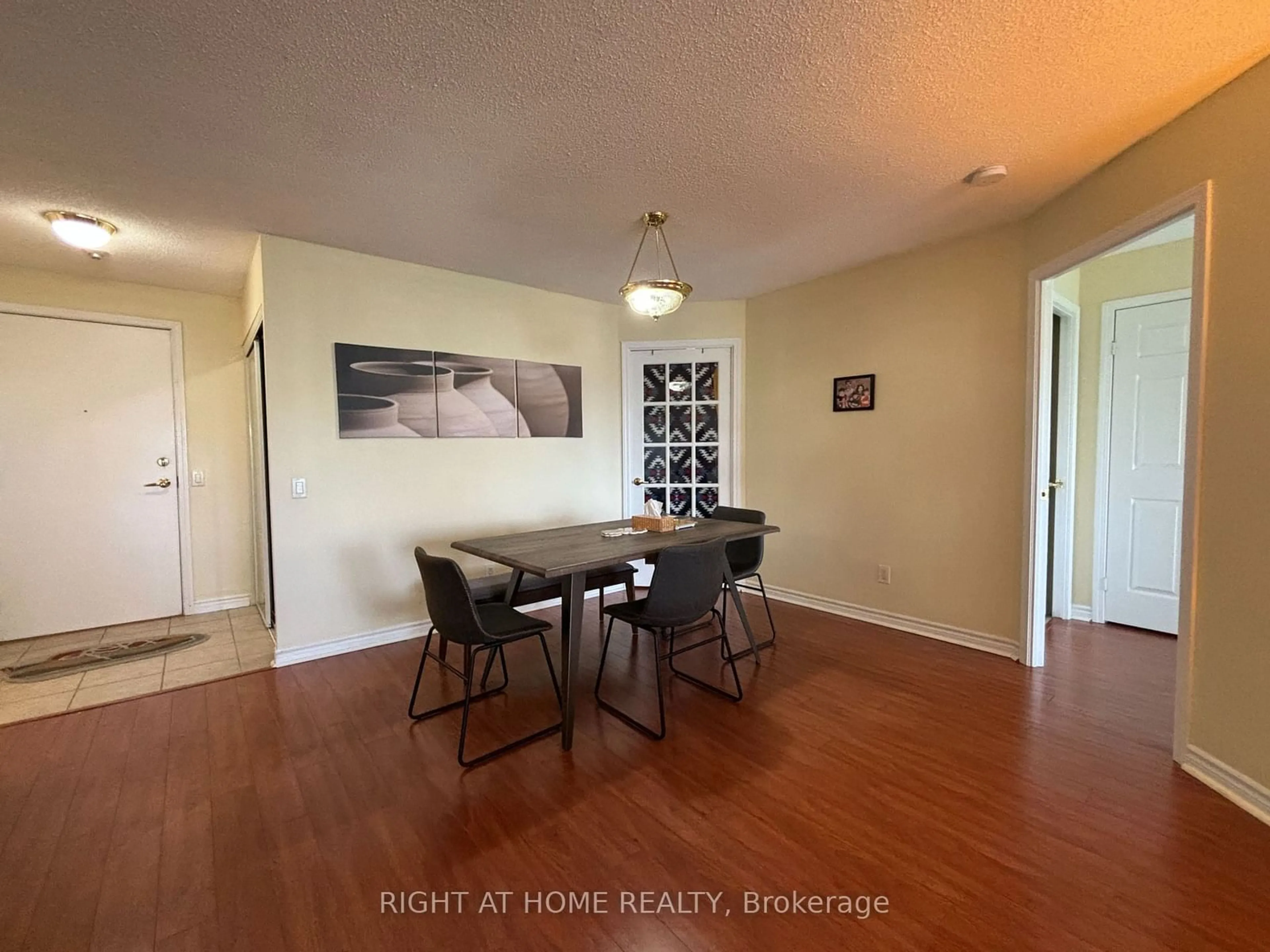 Dining room, wood floors for 25 Kingsbridge Garden Circ #1526, Mississauga Ontario L5R 4B1