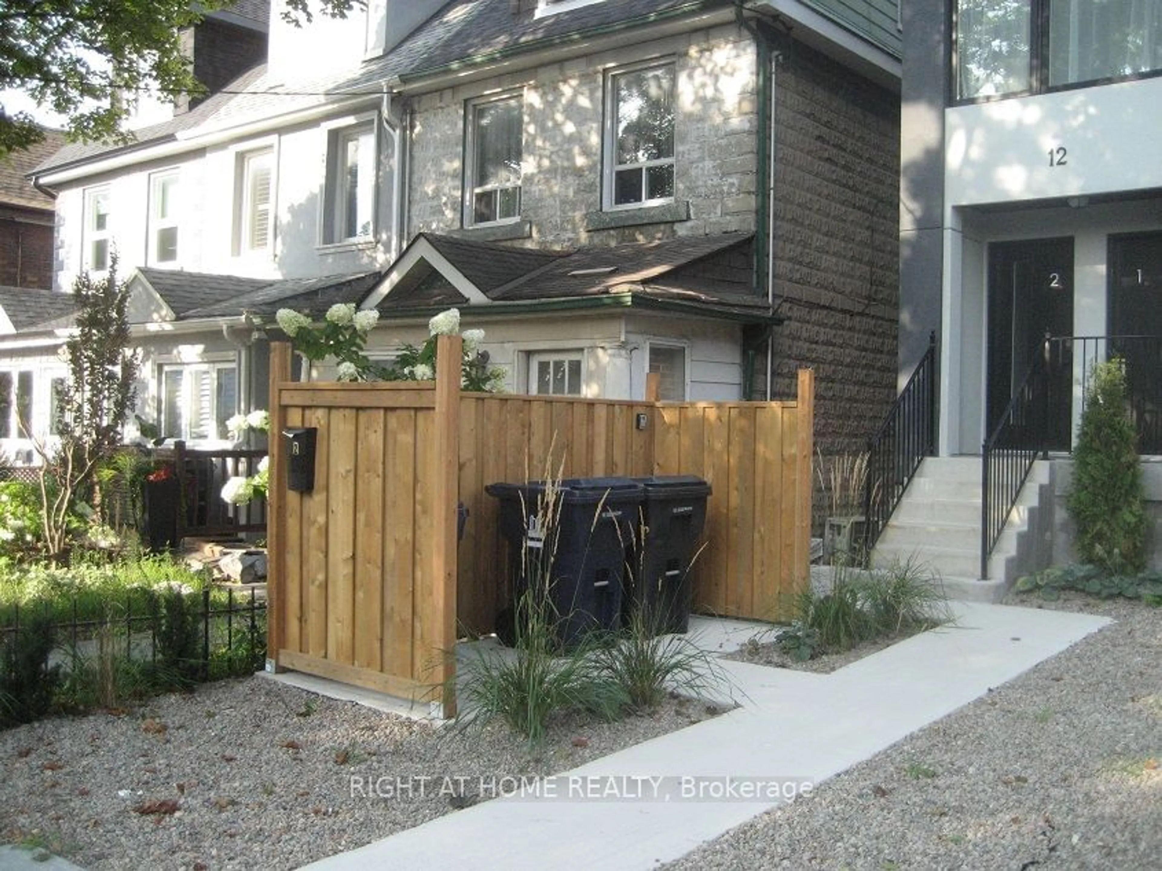 A pic from exterior of the house or condo, the fenced backyard for 12 Batavia Ave, Toronto Ontario M6N 4A2