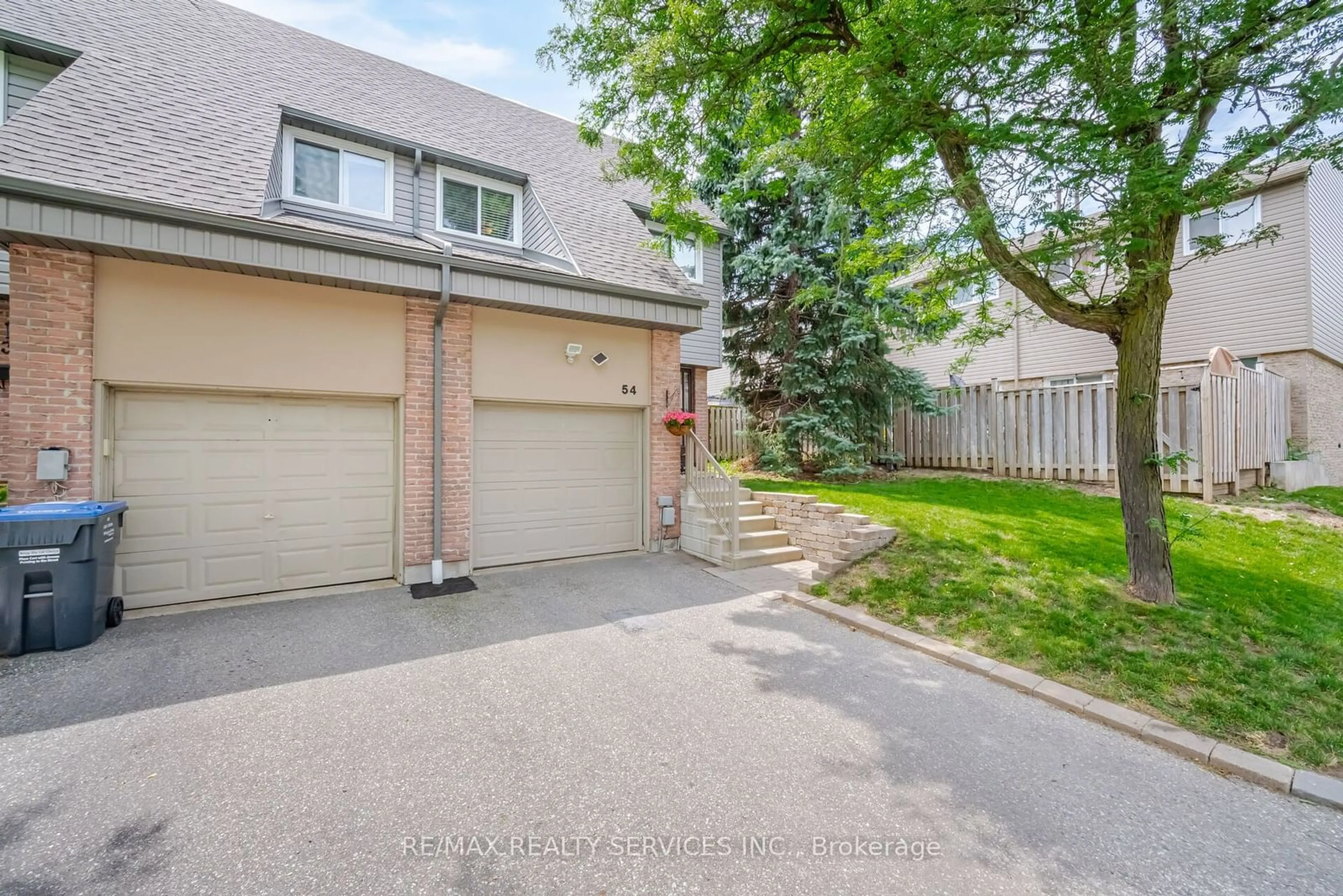 A pic from exterior of the house or condo, the fenced backyard for 54 Tara Park Cres, Brampton Ontario L6V 3E3