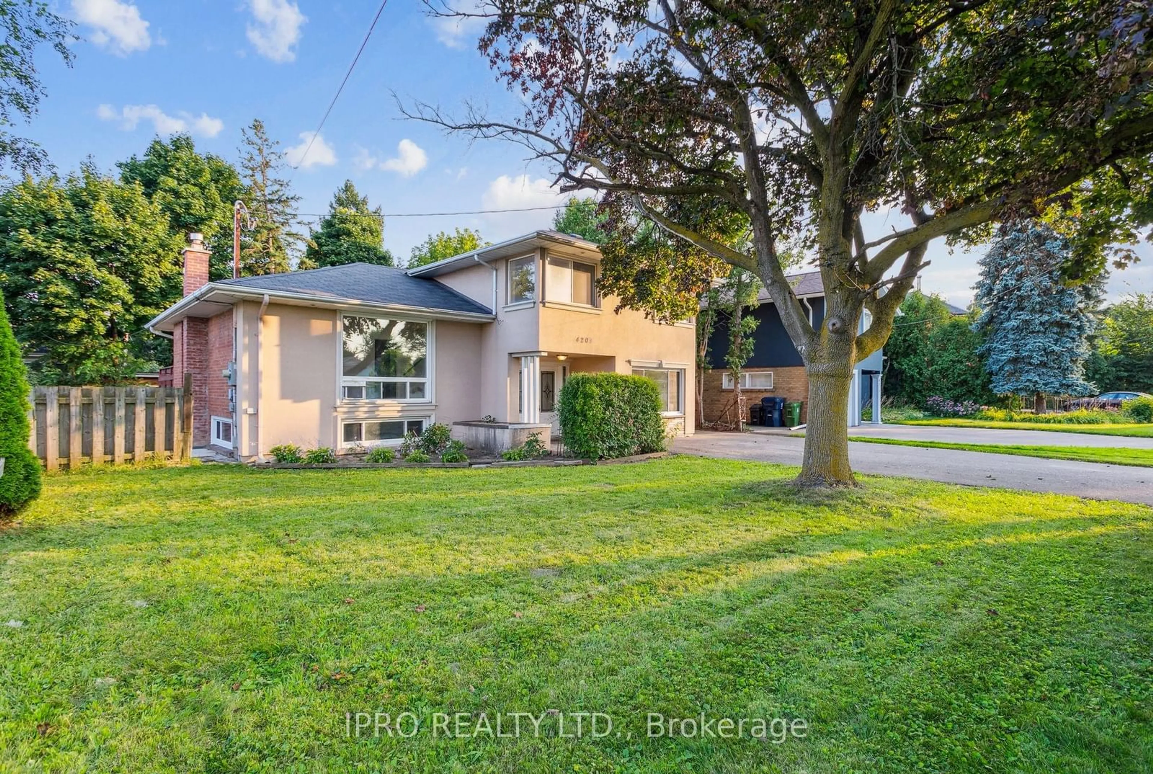 Frontside or backside of a home, the fenced backyard for 4209 Bloor St, Toronto Ontario M9C 1Z6