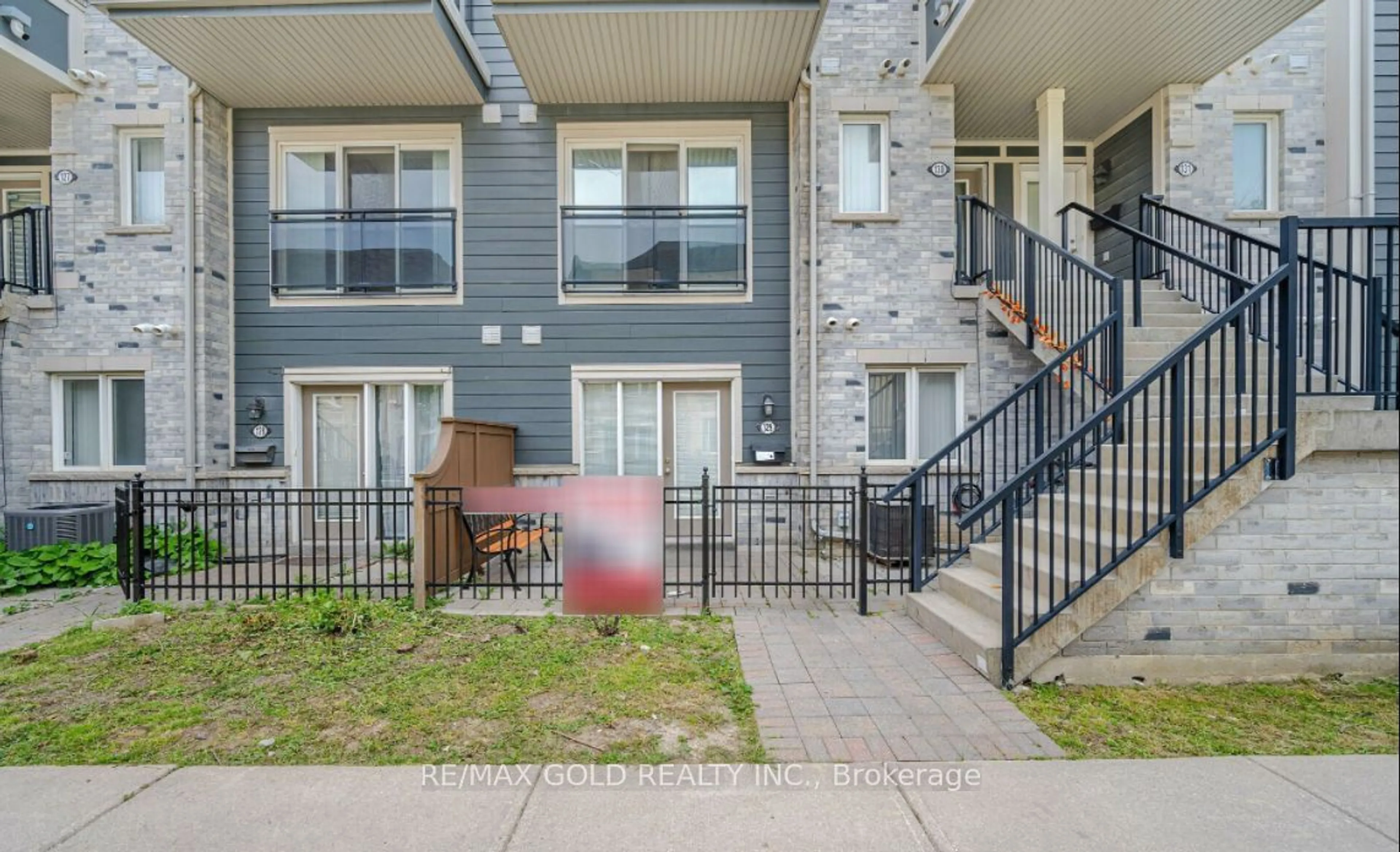 A pic from exterior of the house or condo, the fenced backyard for 60 Fairwood Circ #129, Brampton Ontario L6R 0Y6