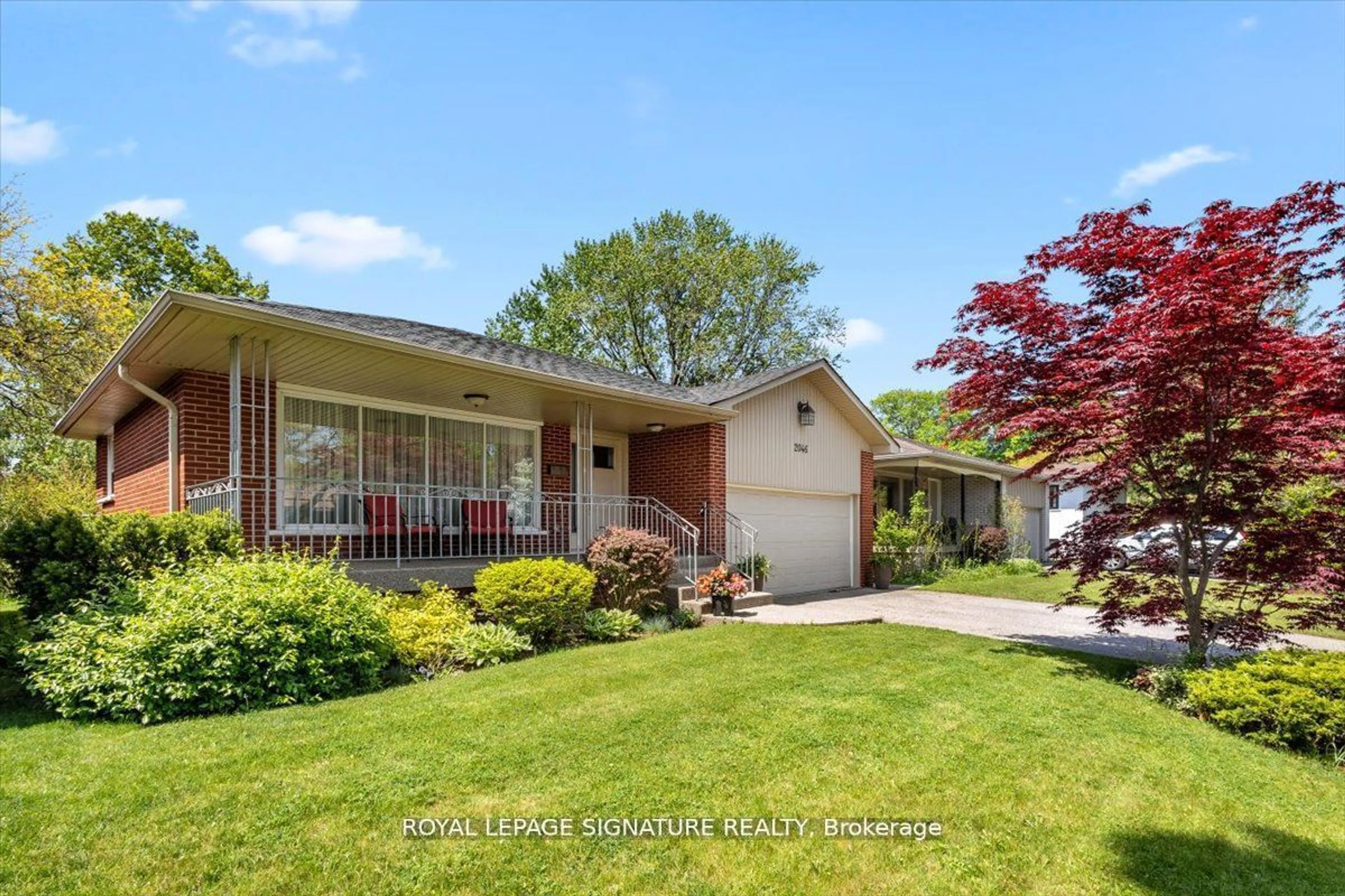 Frontside or backside of a home, the fenced backyard for 2046 Family Cres, Mississauga Ontario L4X 1G6