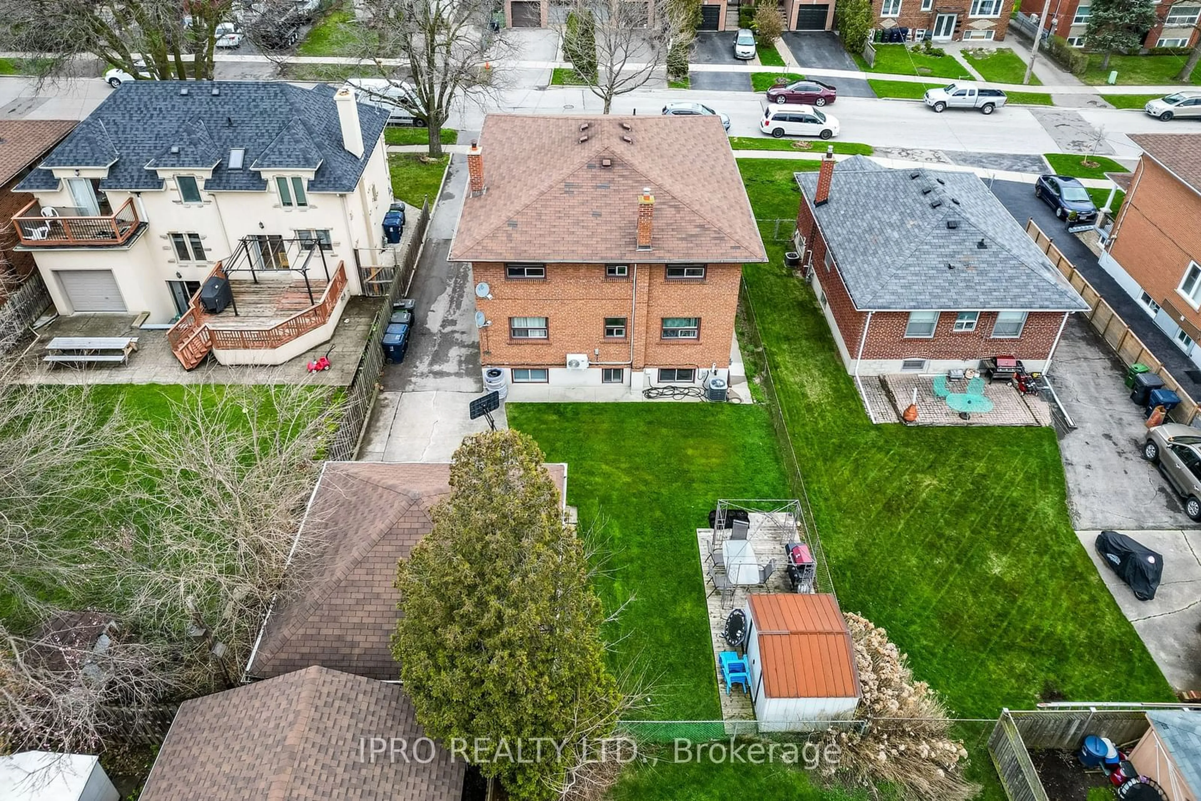 Frontside or backside of a home, the fenced backyard for 246 Delta St, Toronto Ontario M8W 4E9