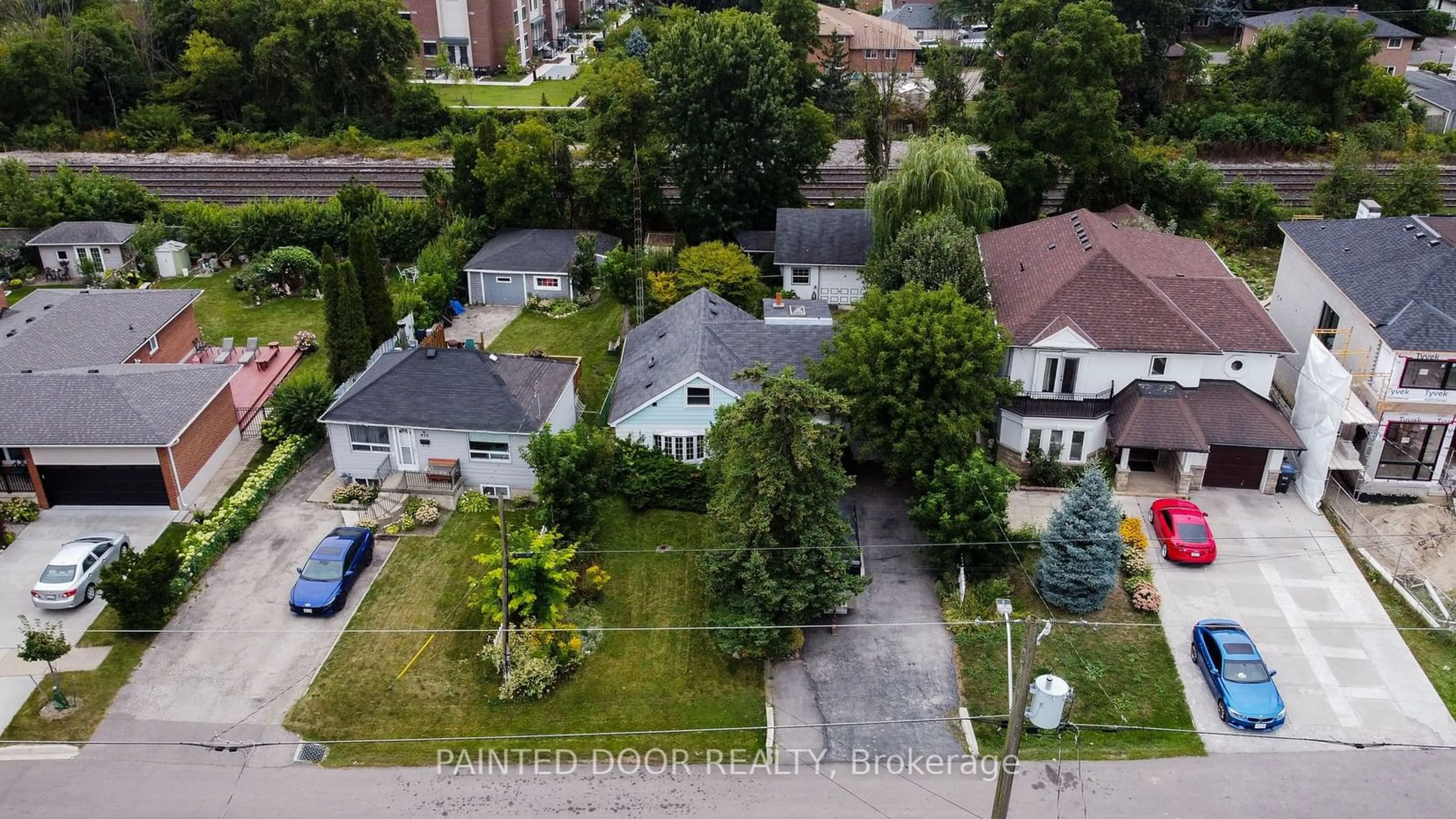 Frontside or backside of a home, the fenced backyard for 450 Marf Ave, Mississauga Ontario L5G 1T3