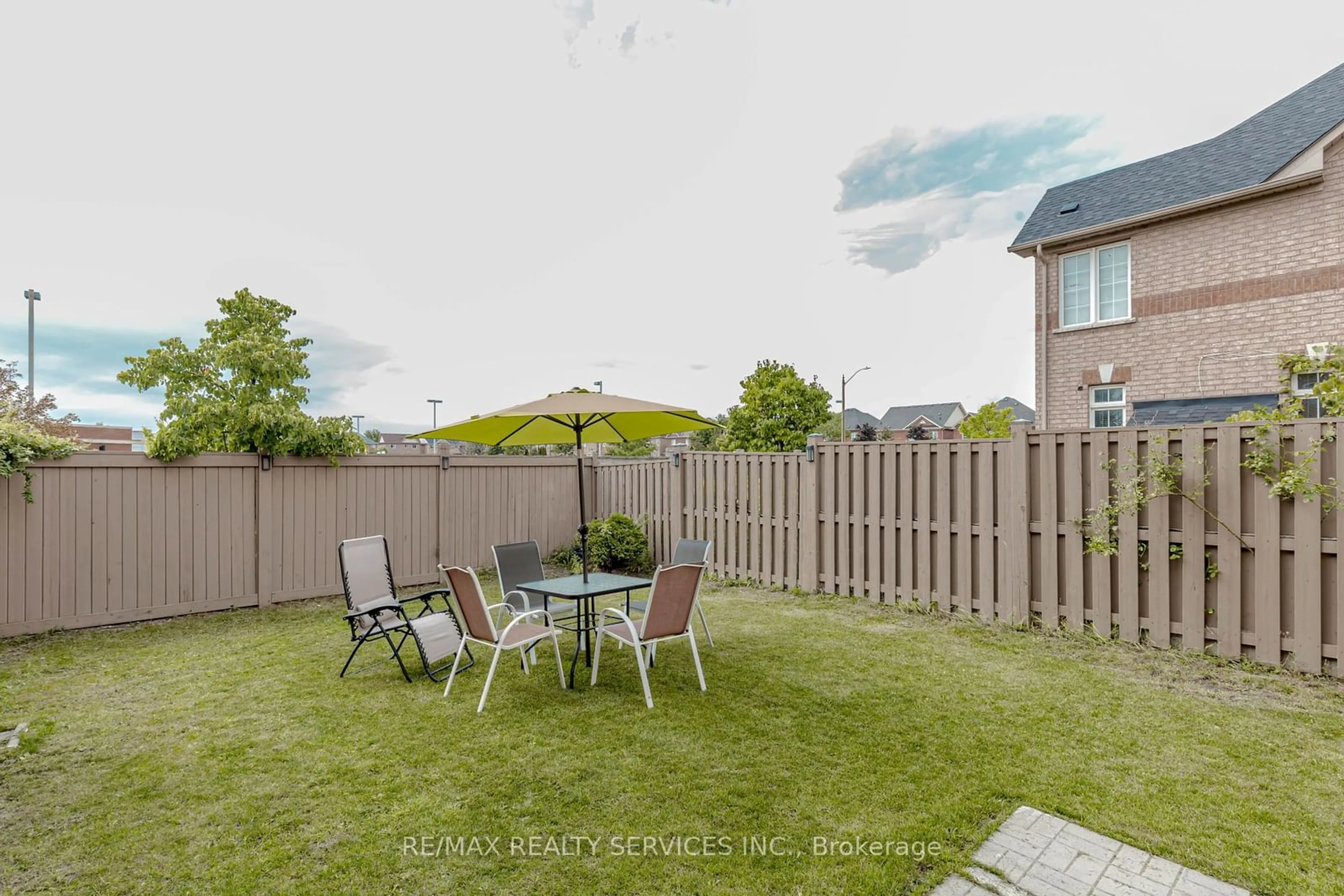 Patio, the fenced backyard for 475 Van Kirk Dr, Brampton Ontario L7A 0J2