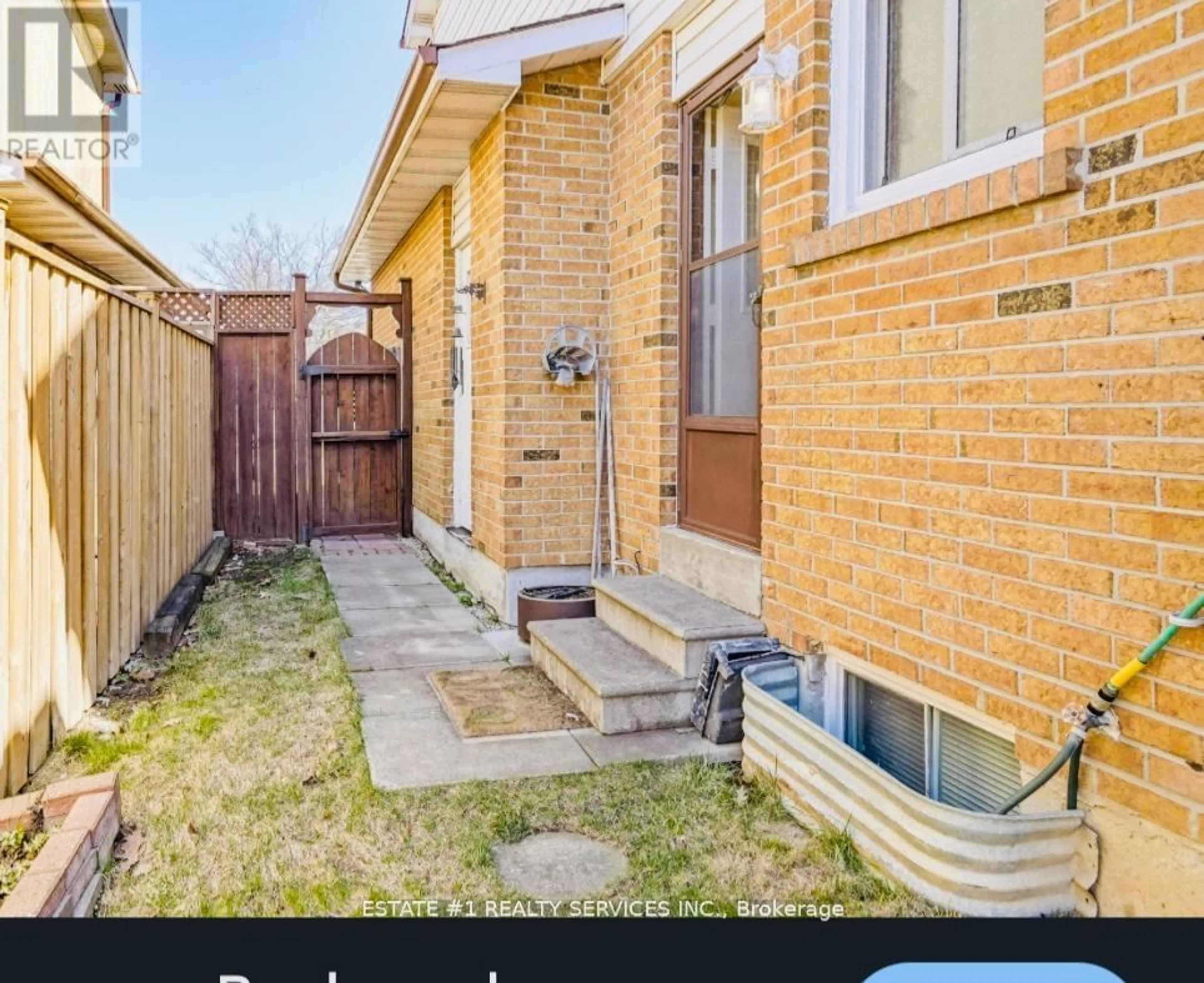 Frontside or backside of a home, the fenced backyard for 84 Simmons Blvd, Brampton Ontario L6V 3V6