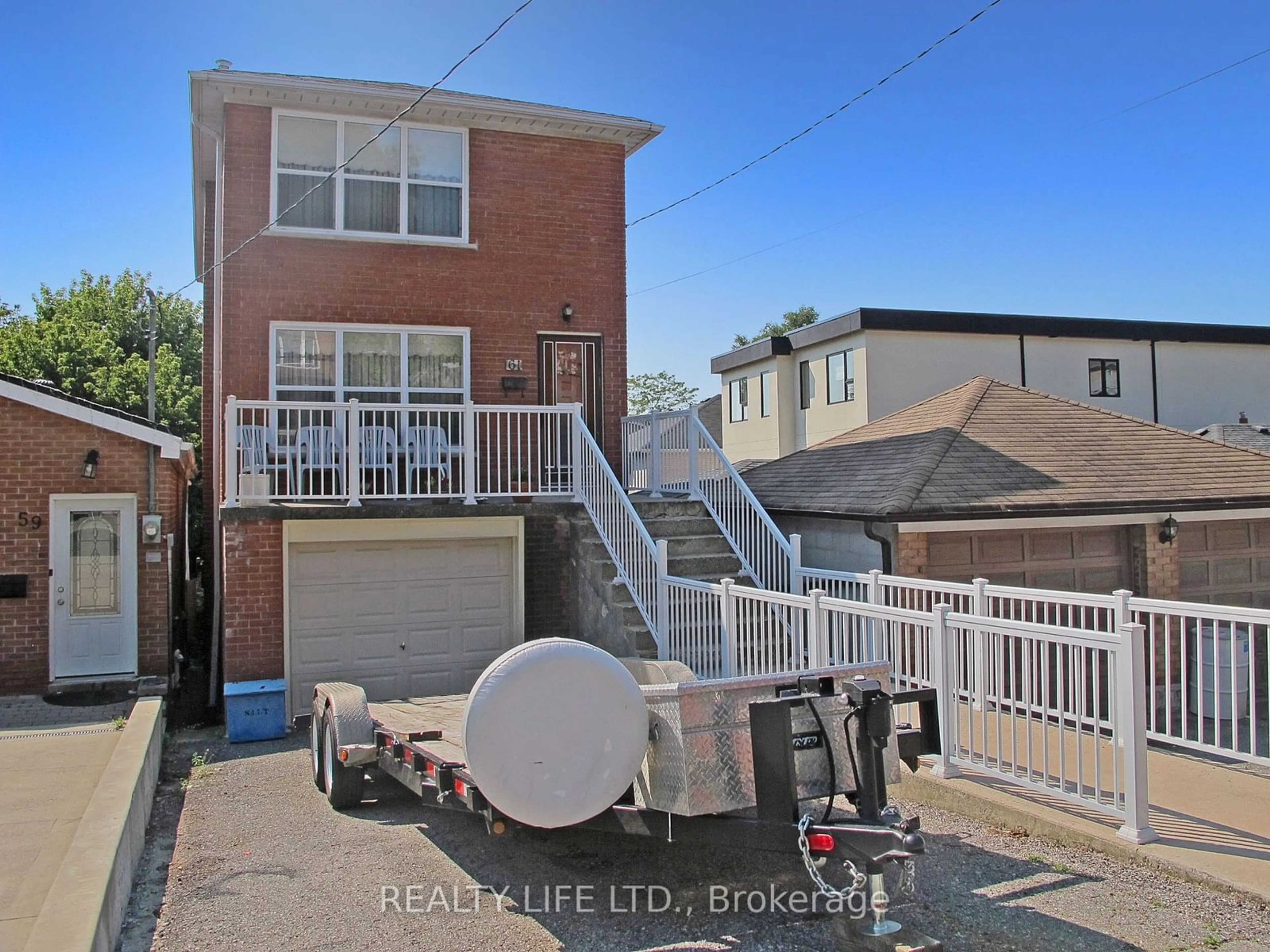 Frontside or backside of a home, the street view for 61 Cameron Ave, Toronto Ontario M6M 1R1