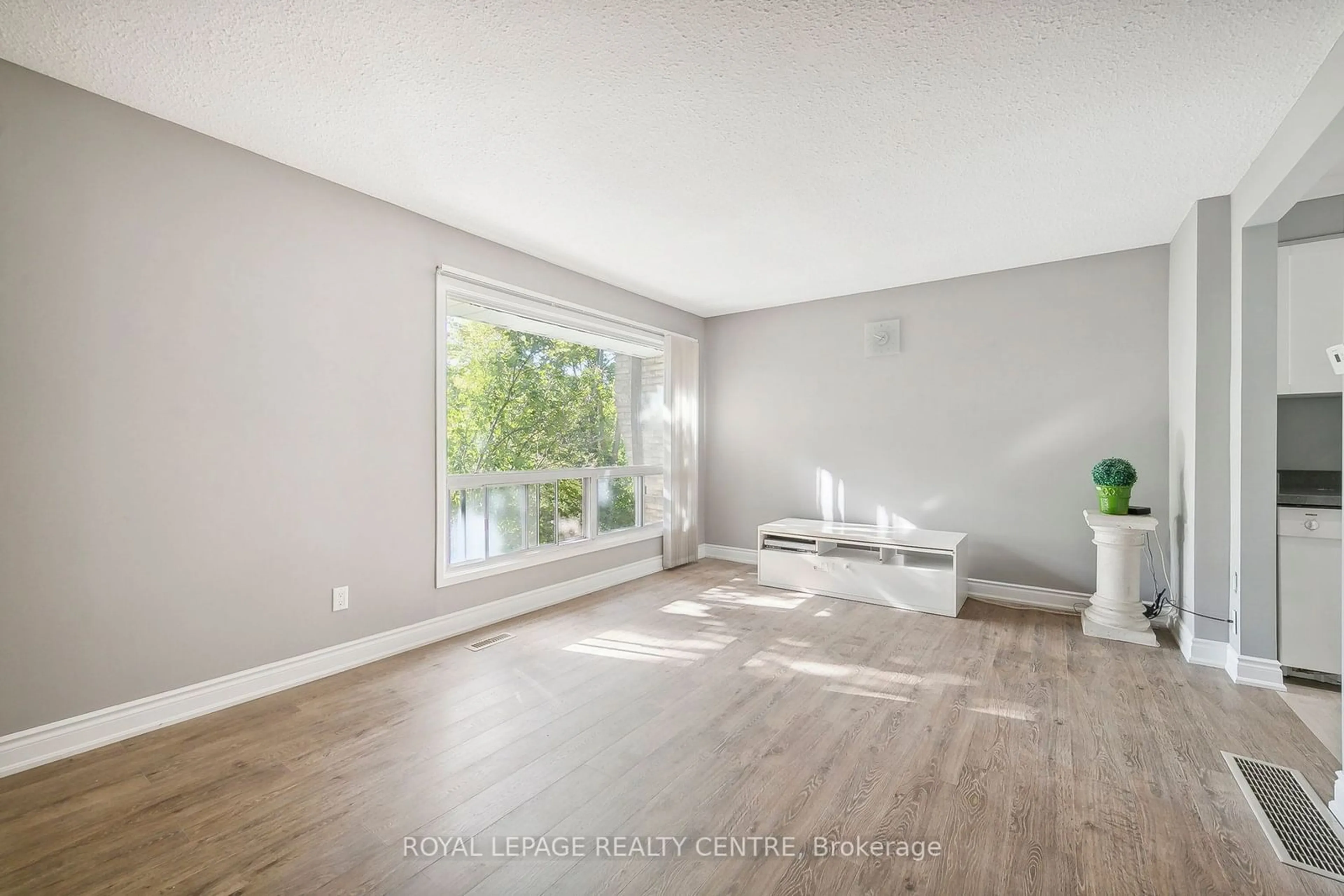 A pic of a room, wood floors for 915 Inverhouse Dr #61, Mississauga Ontario L5J 4B2