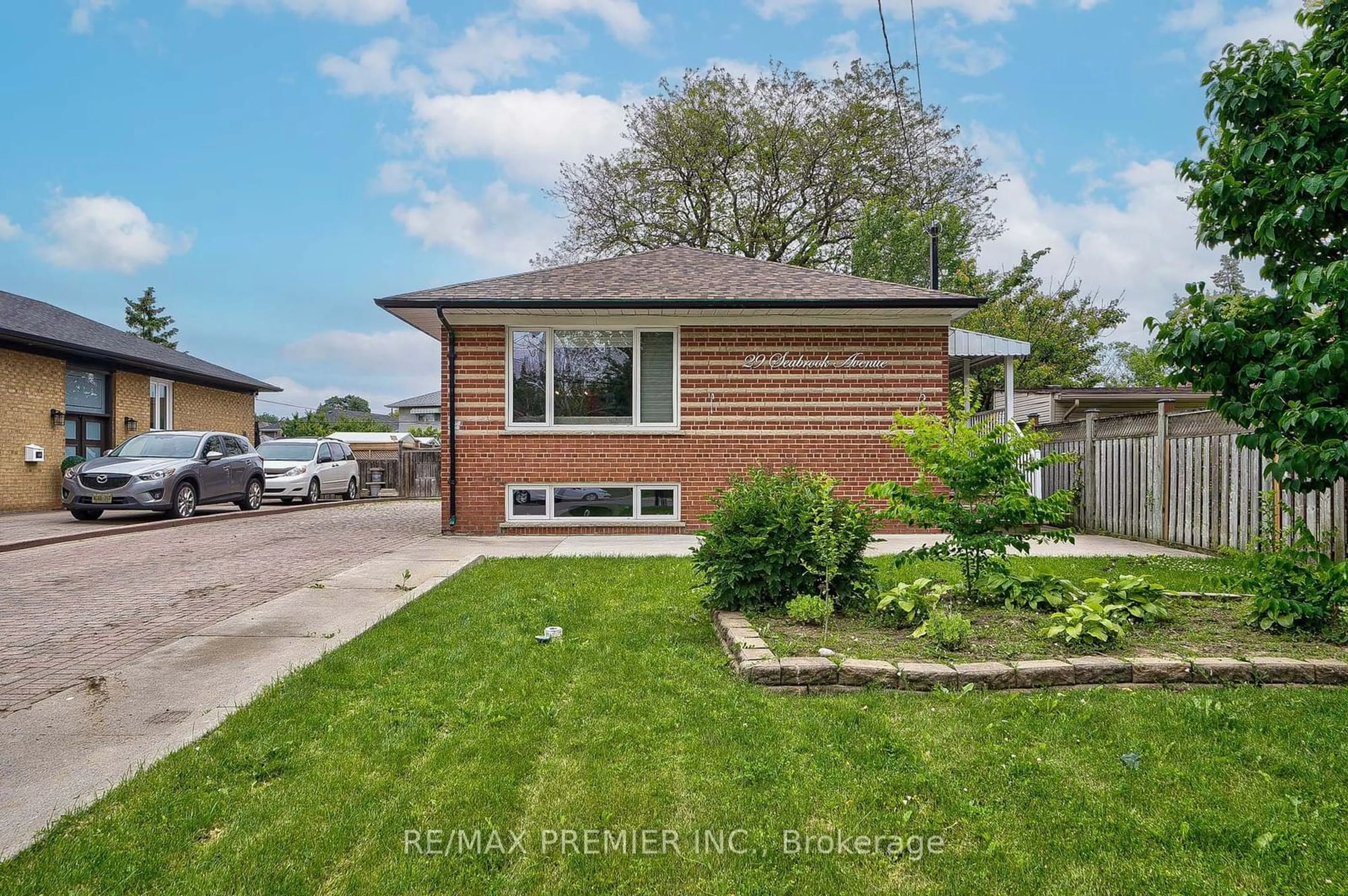 Frontside or backside of a home, the fenced backyard for 29 Seabrook Ave, Toronto Ontario M6L 3B6