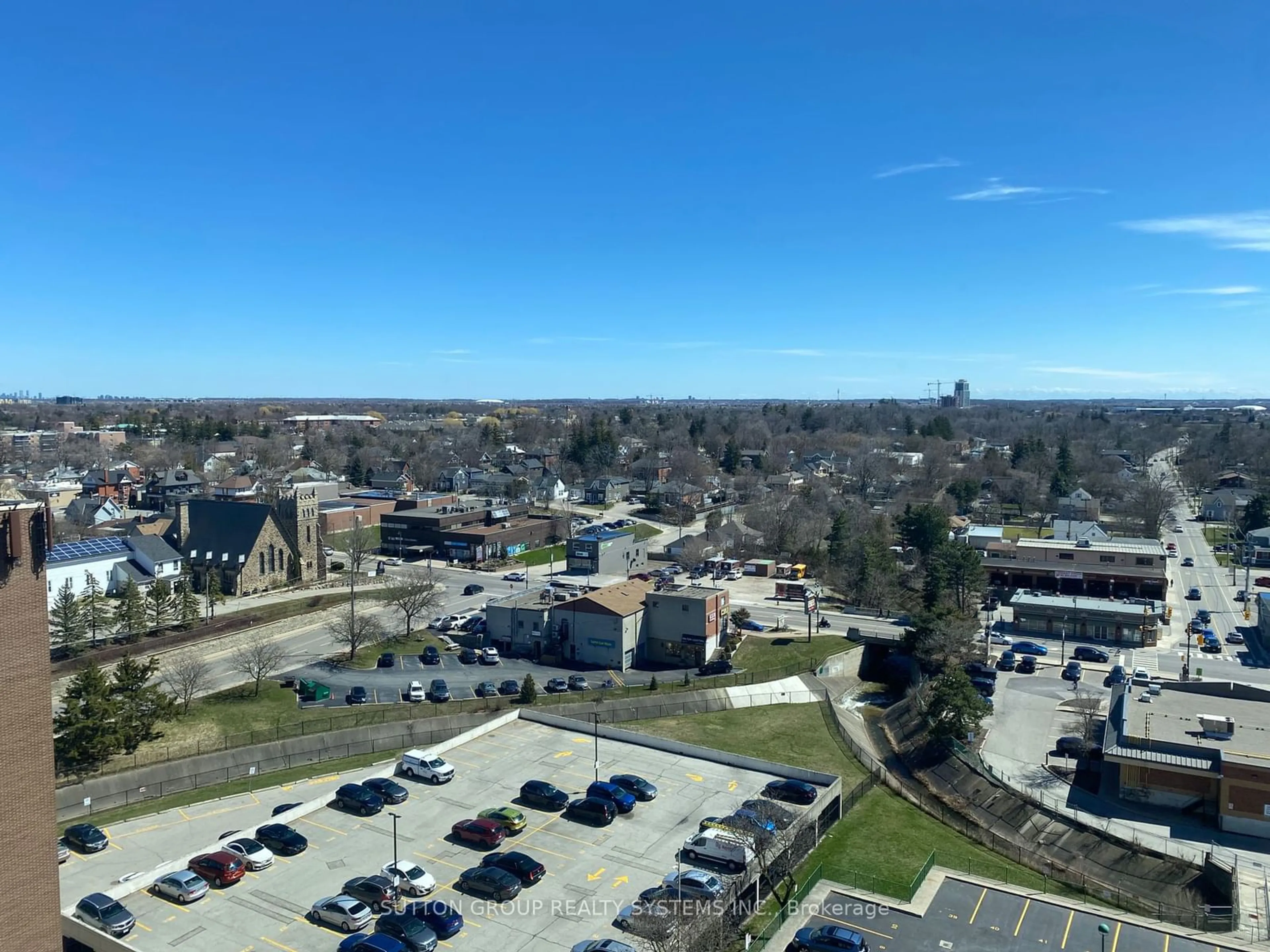 A pic from exterior of the house or condo, the street view for 100 Millside Dr #1402, Milton Ontario L9T 5E3