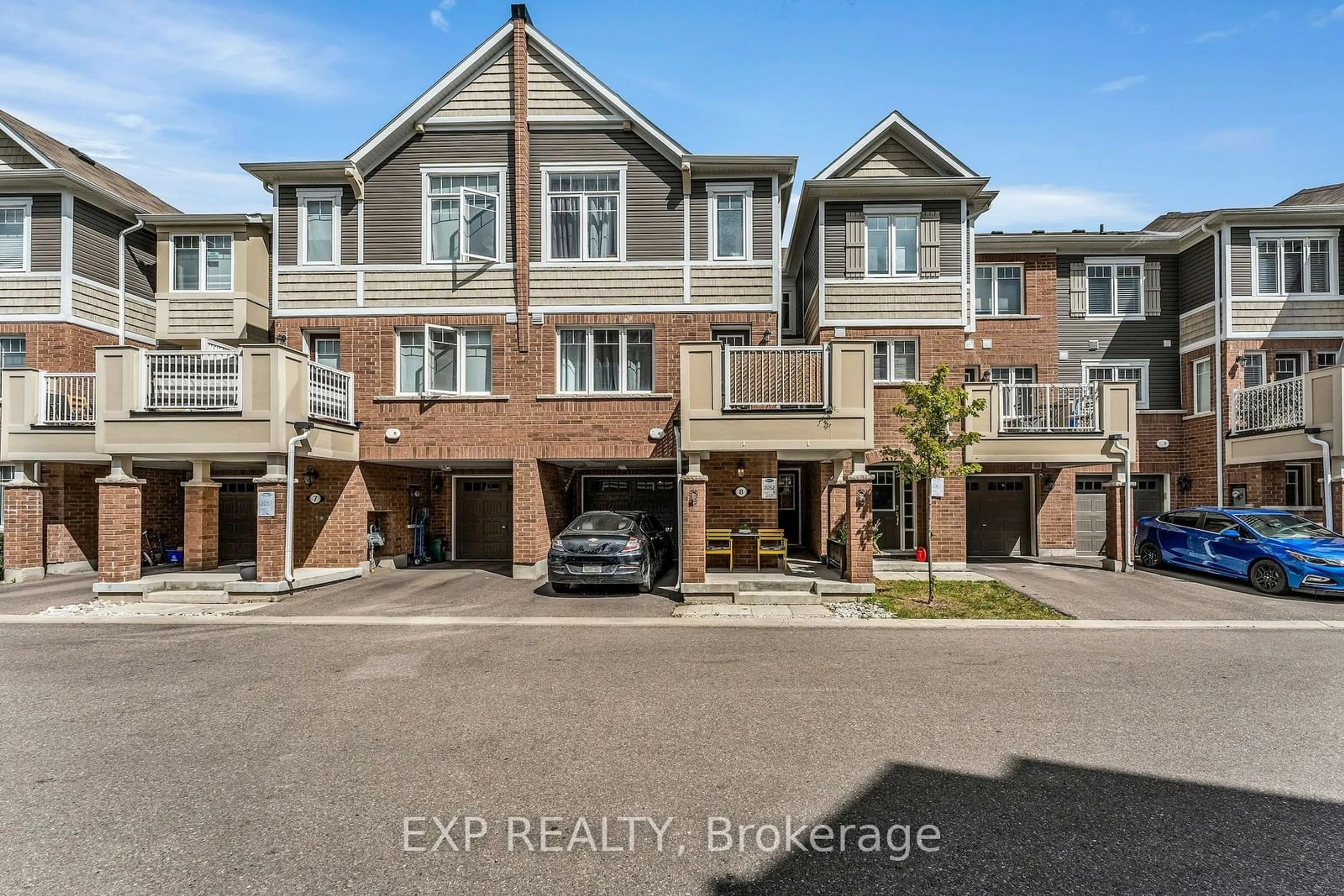 A pic from exterior of the house or condo, the street view for 1222 Rose Way #8, Milton Ontario L9E 1P1