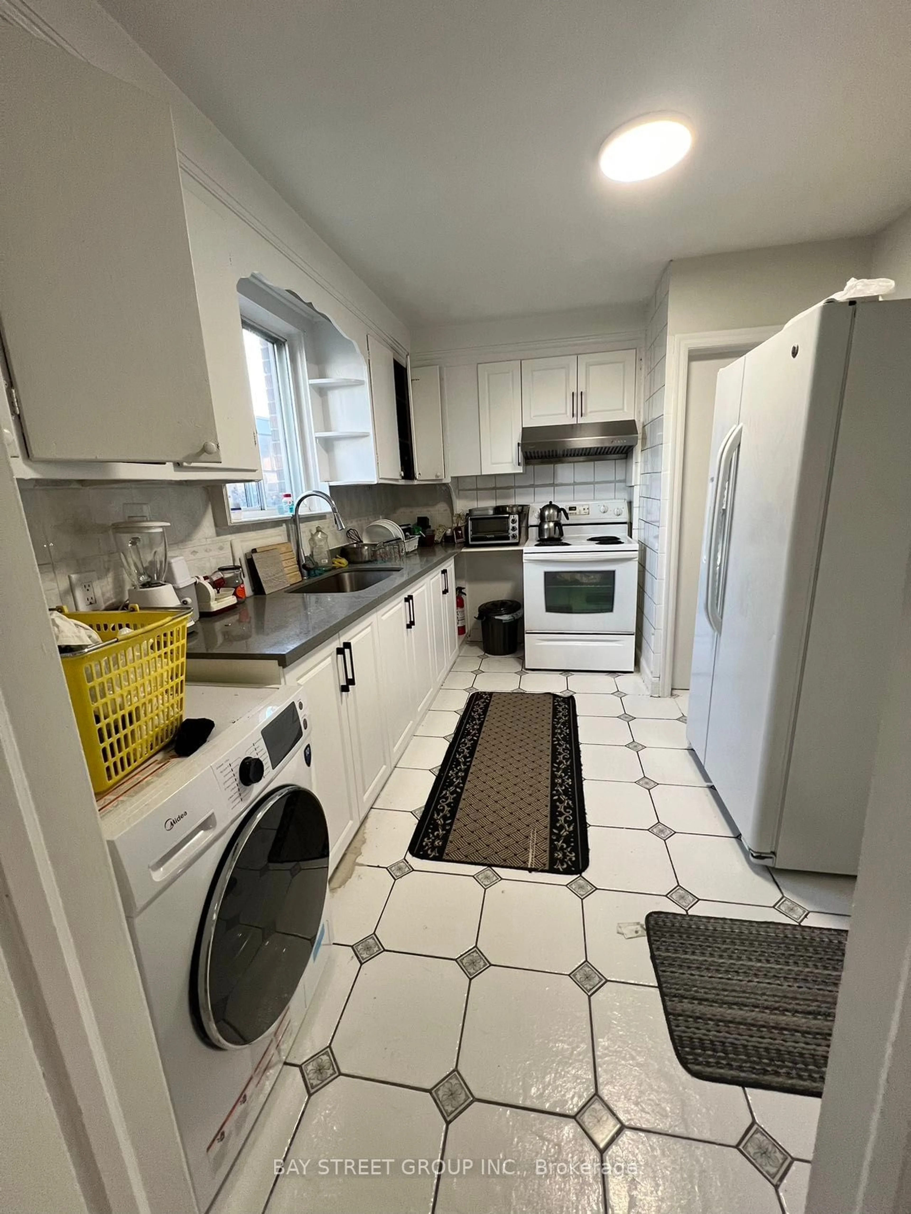 Kitchen with laundary machines for 1 Datchet Rd, Toronto Ontario M3M 1X4