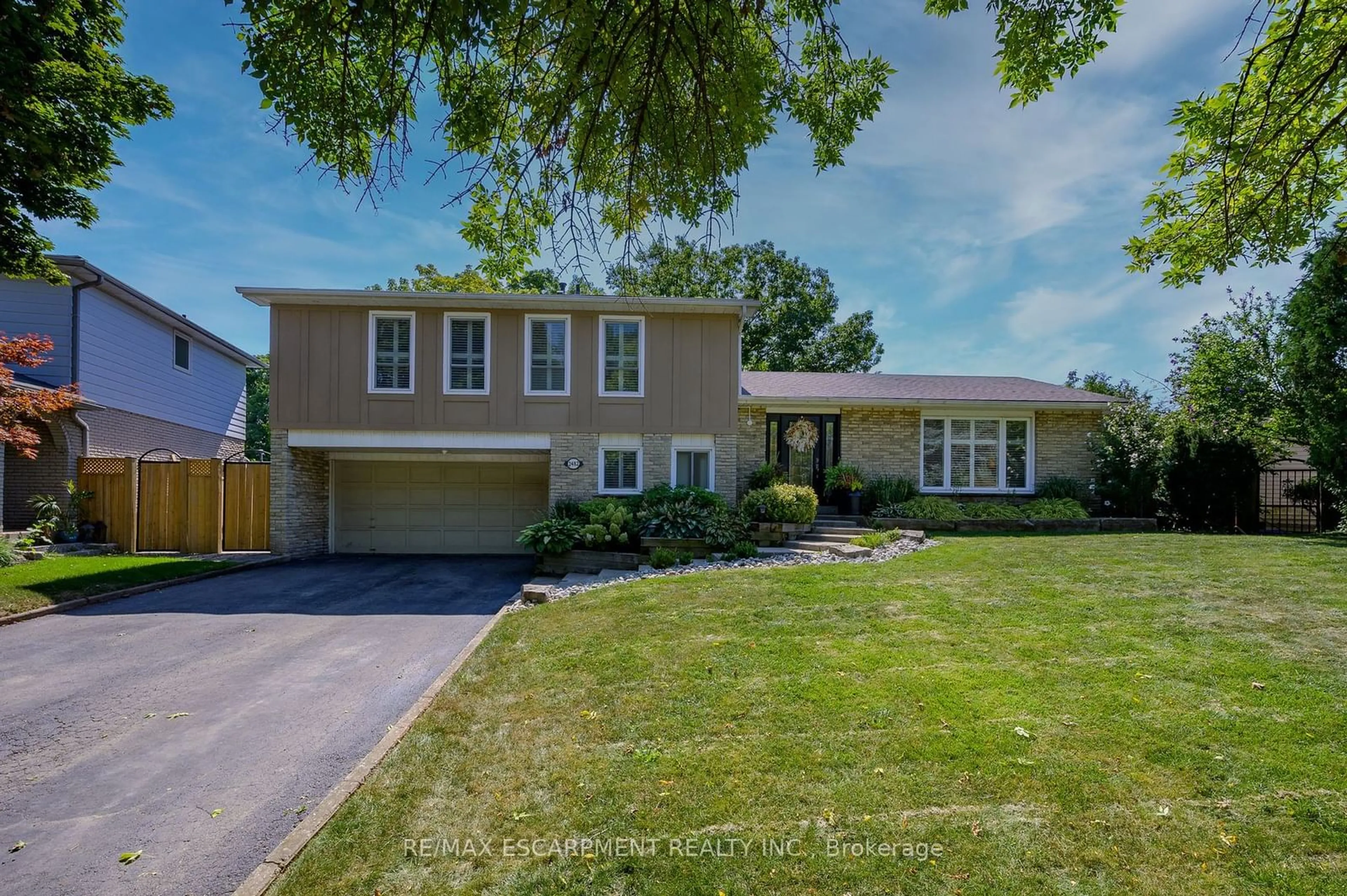 Frontside or backside of a home, the street view for 2482 Waterford St, Oakville Ontario L6L 5E6