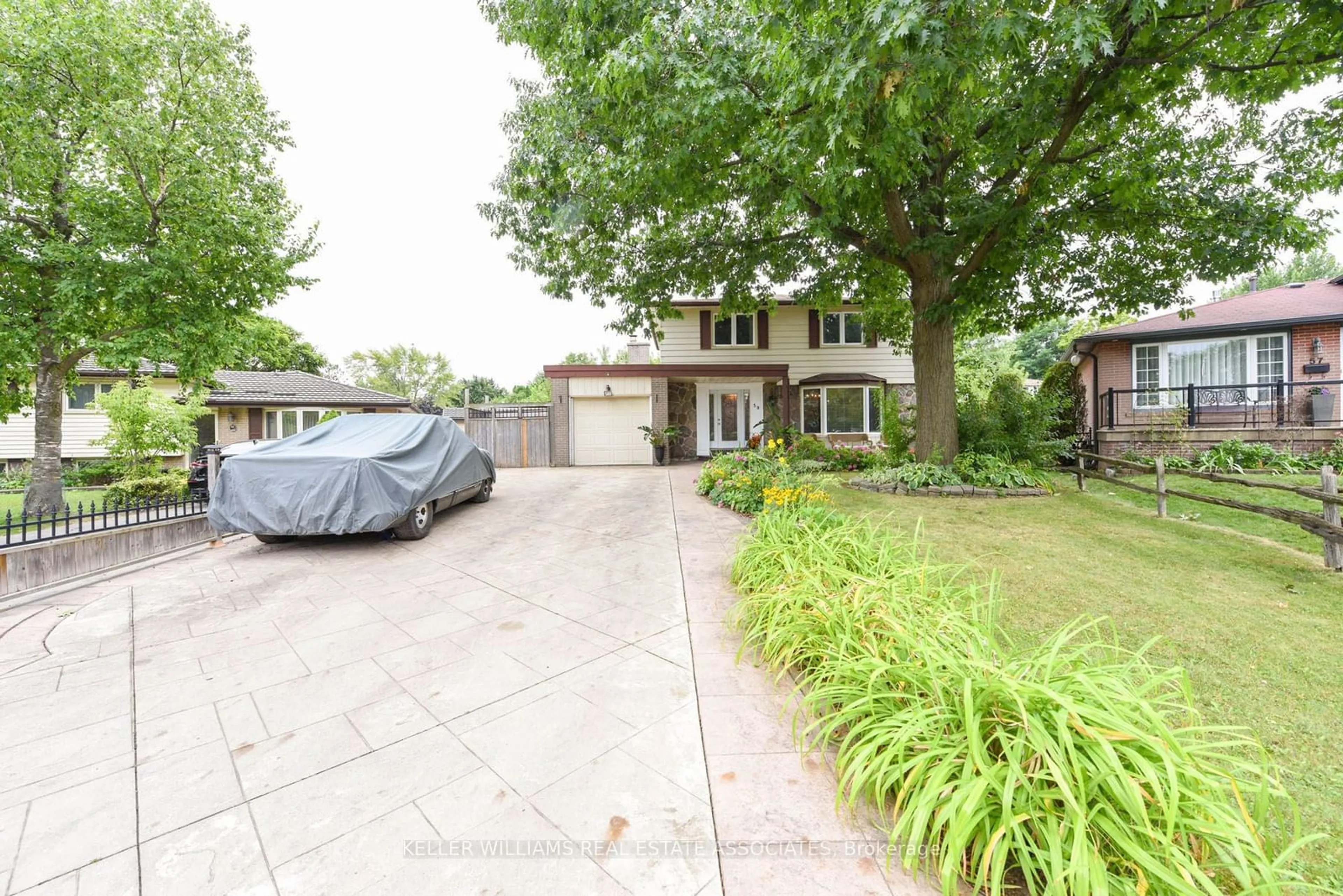 Frontside or backside of a home, the street view for 59 Watson Cres, Brampton Ontario L6W 1E5